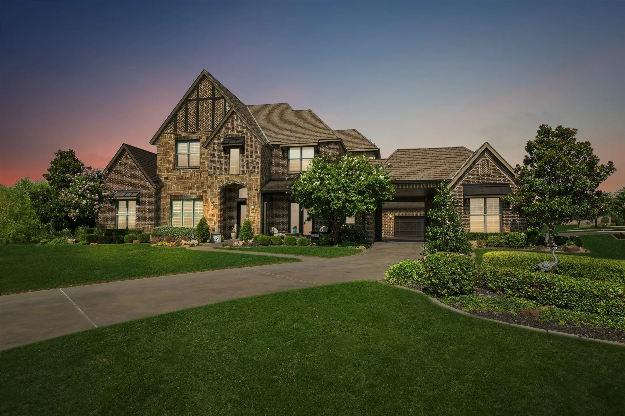 Stone and brick exterior with contrasting dark trim accents and multiple gables