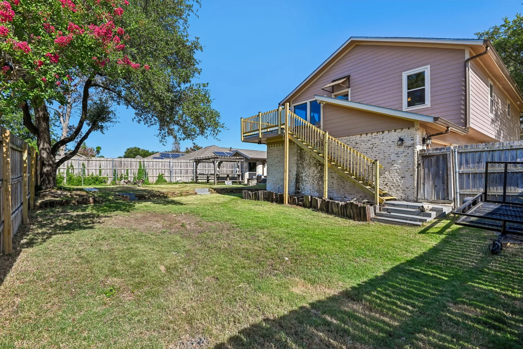 Large Side yard with staircase to apartment