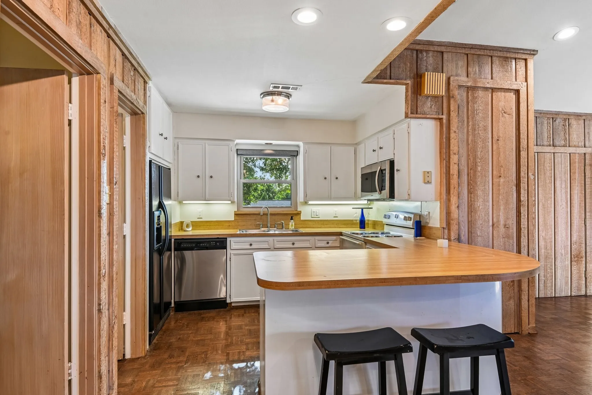 Upstairs full kitchen with breakfast bar