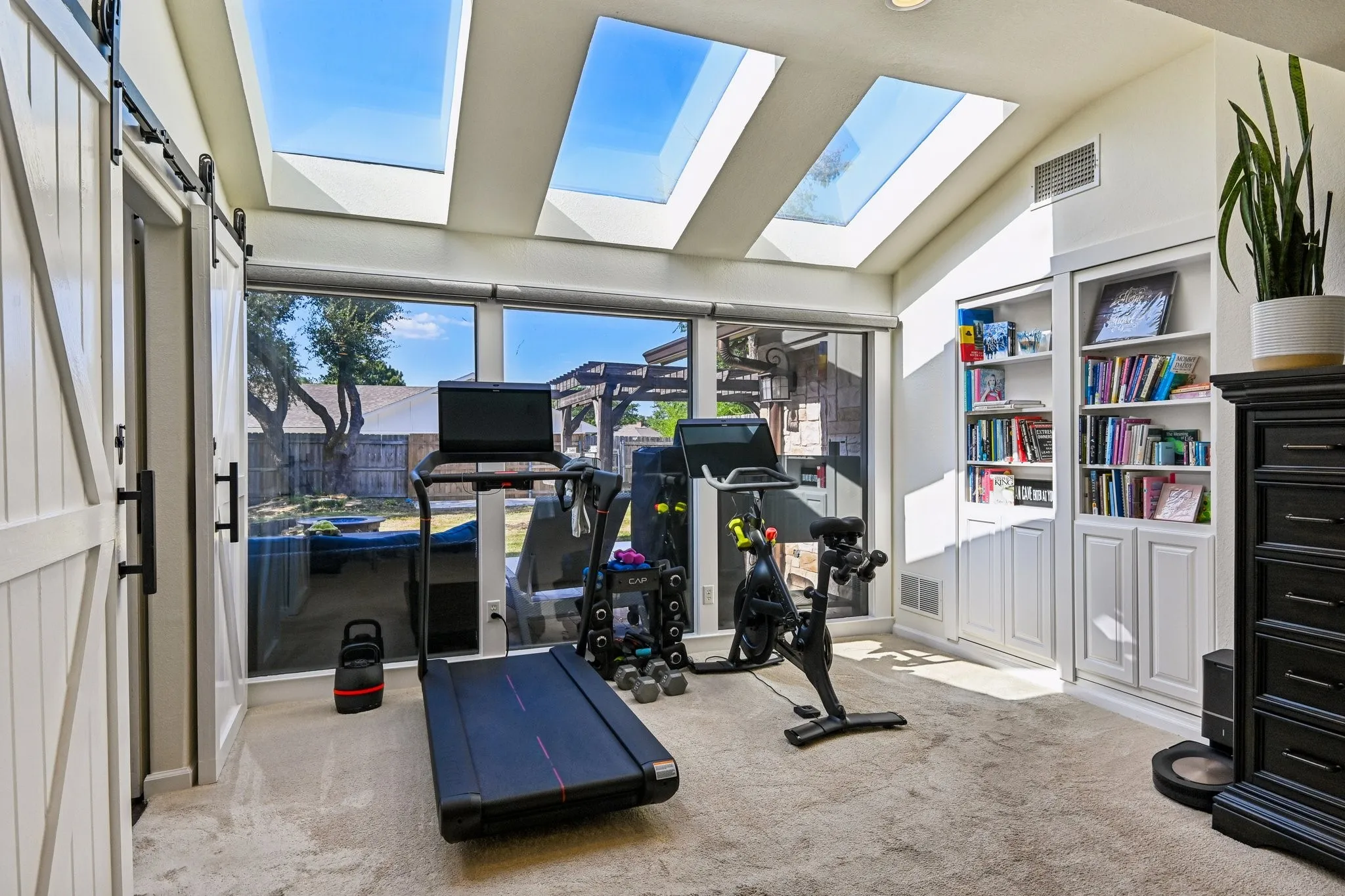 Master Bedroom flex space with bookshelves that open to "hidden room"