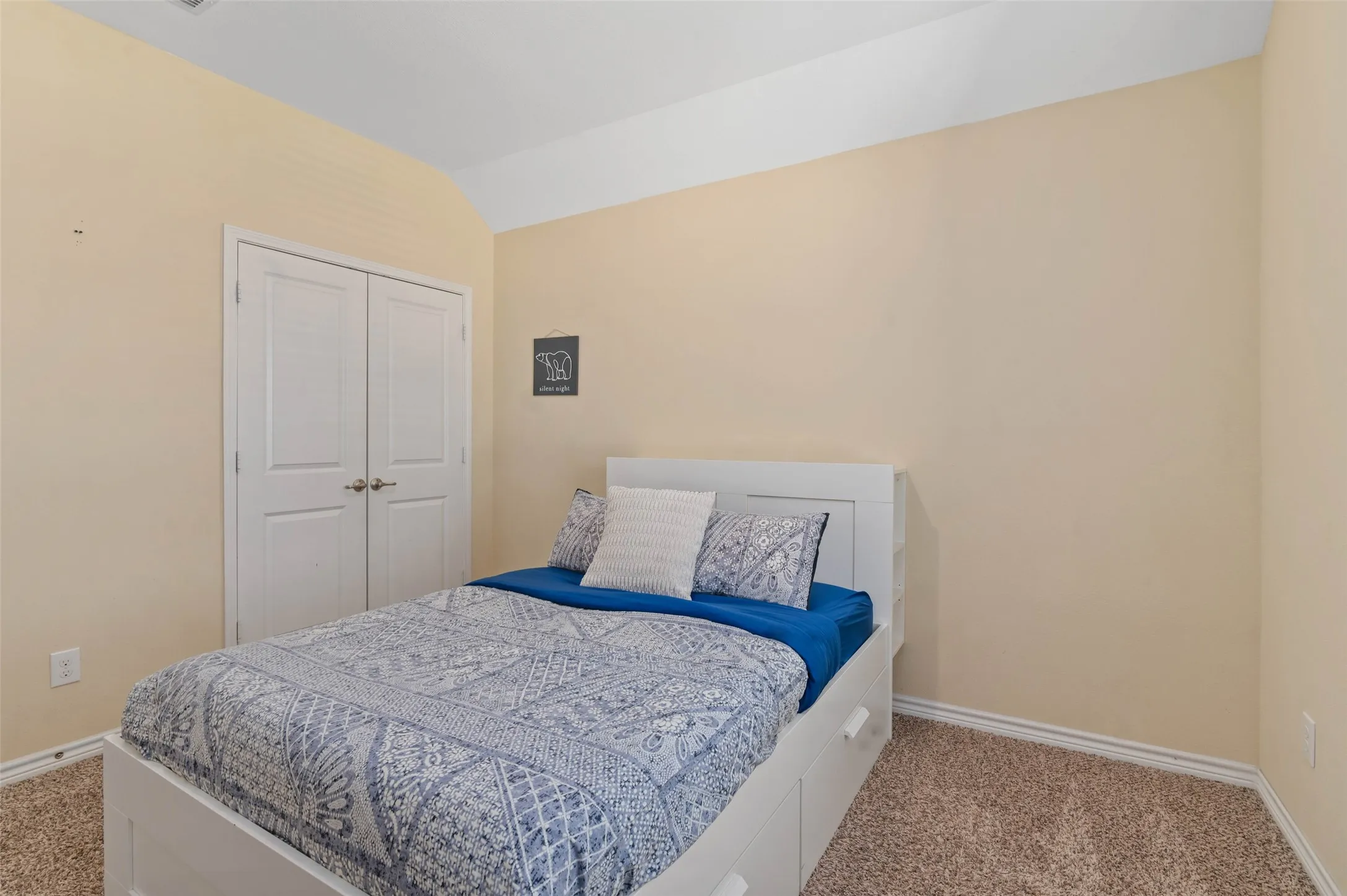 Neutral-toned walls complement plush carpeting
