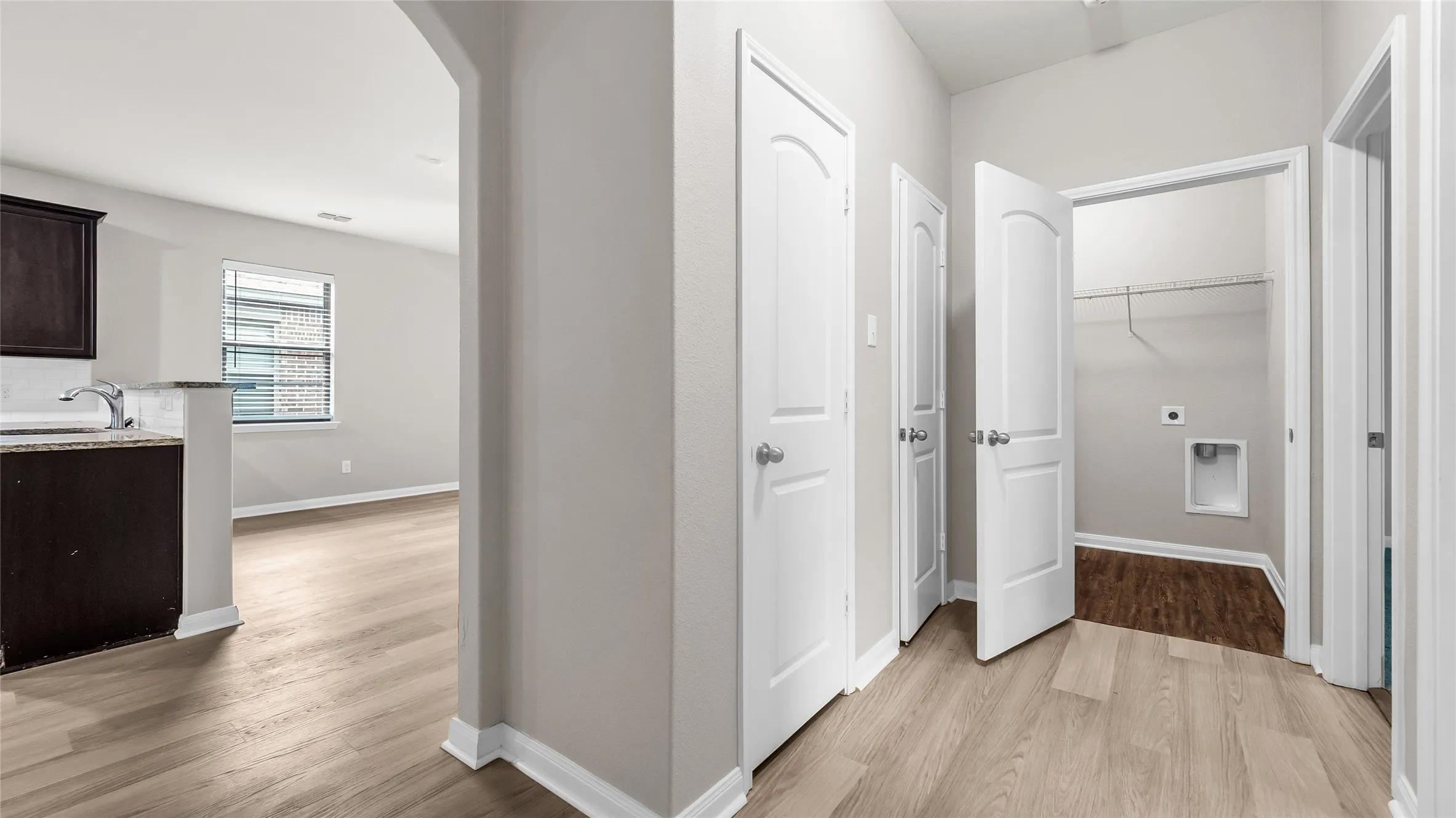 Hallway to additional bedrooms, hall closets, laundry and guest bath.