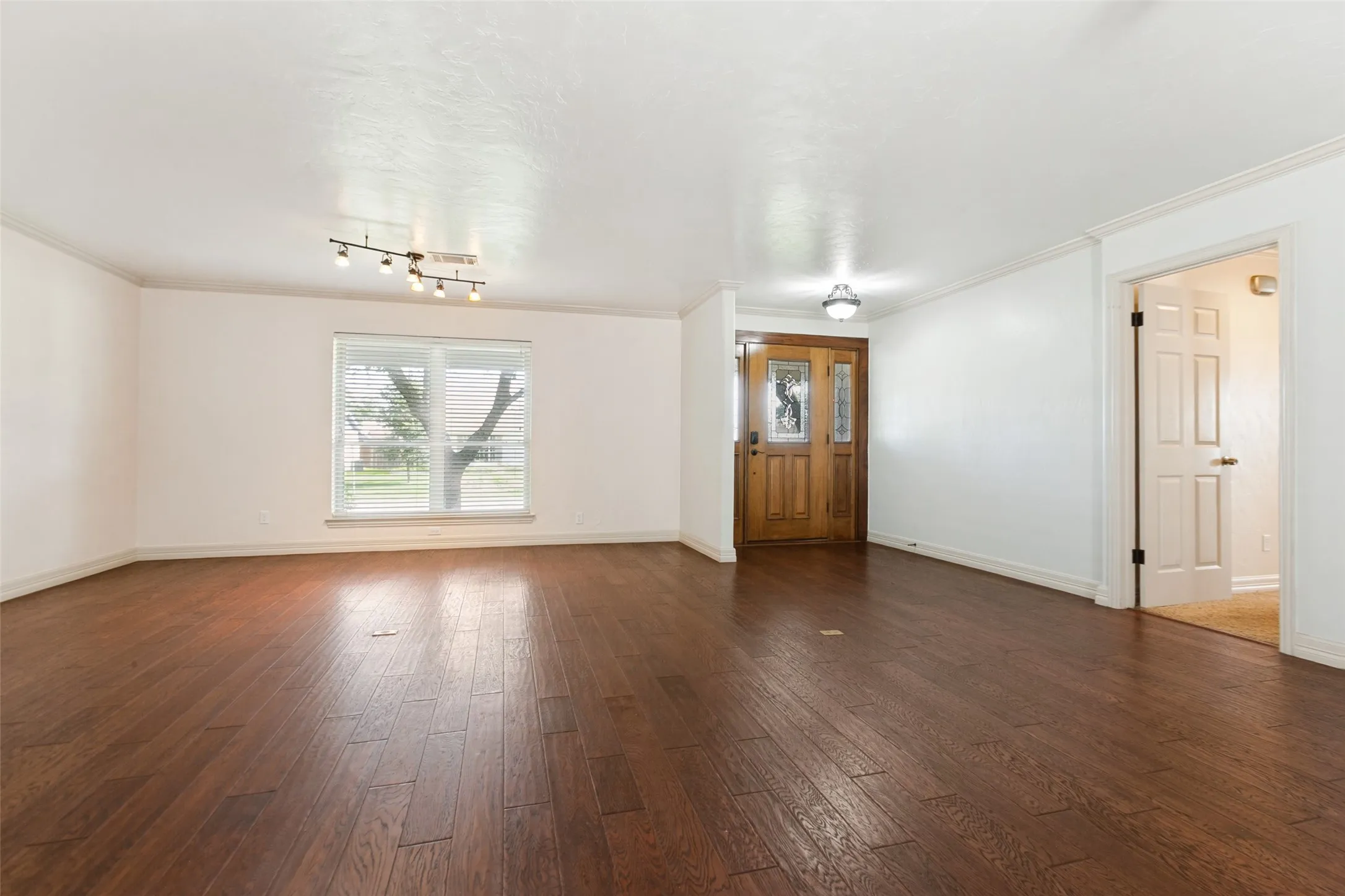 Wood floors throughout the living and dining room