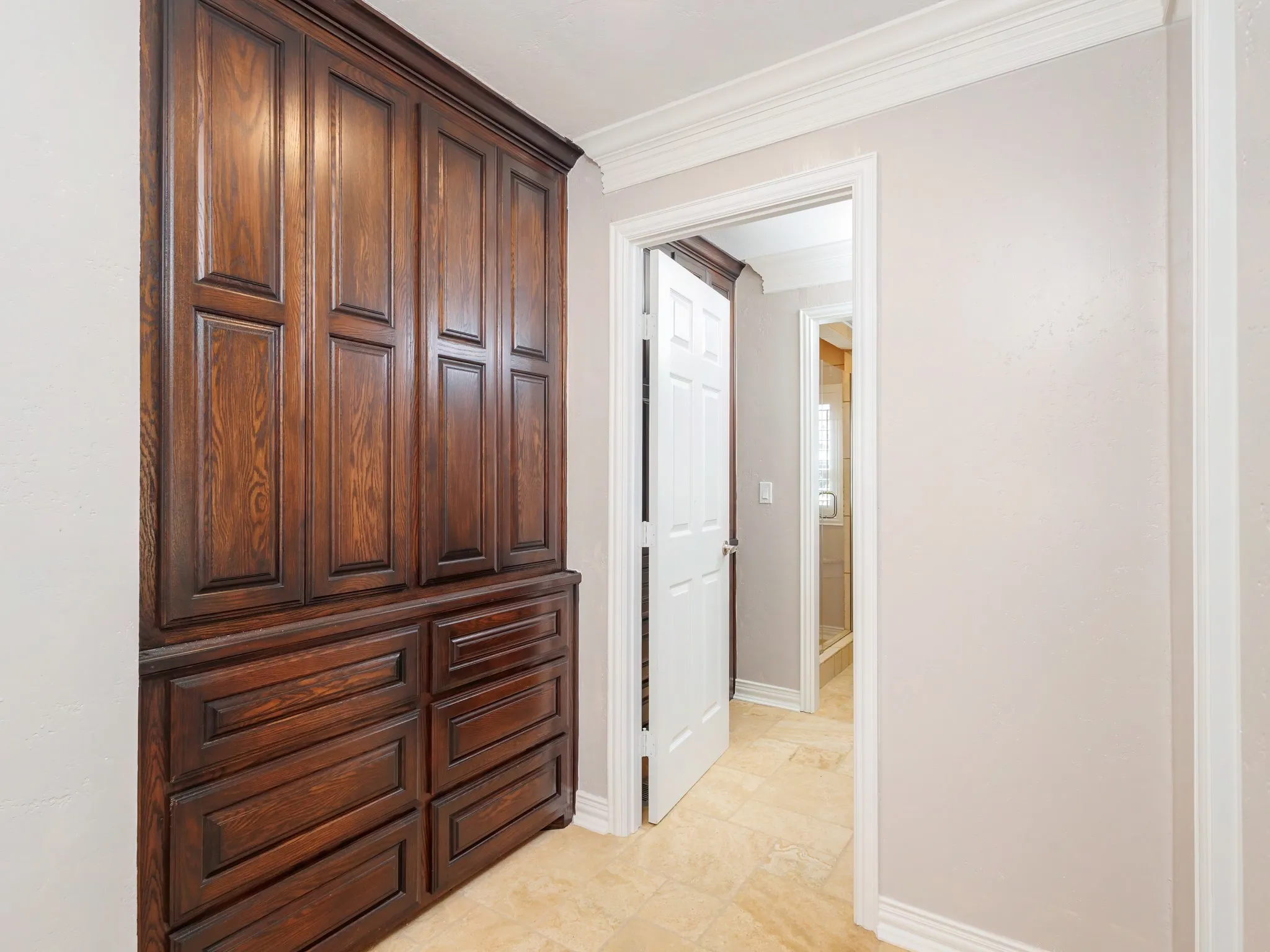 Built-in custom cabinetry featuring dark wood-finish doors and drawers