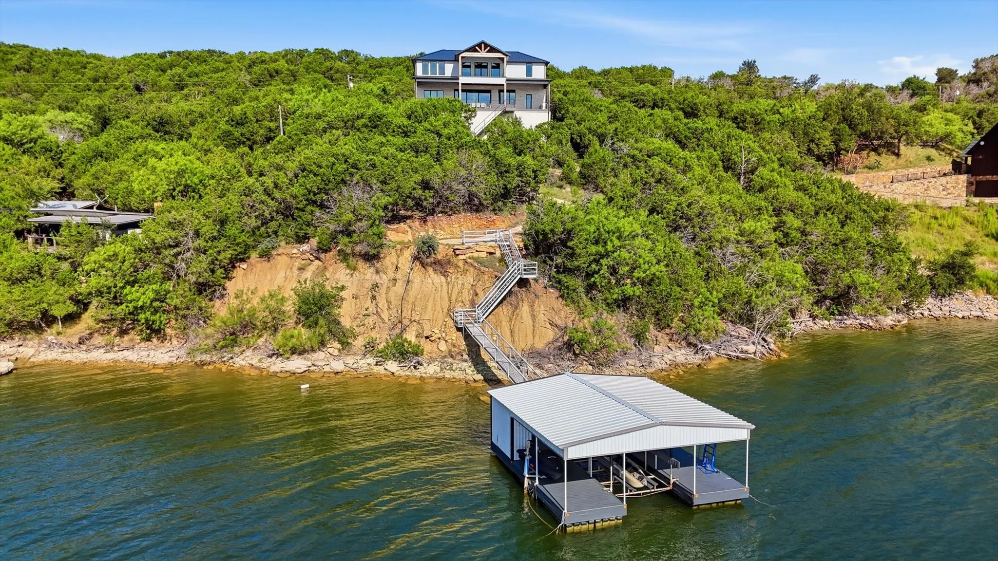 Single Family Residence For Sale in Palo Pinto County , 2449 Upper Burma Road, Possum Kingdom Lake, Texas 76449, 4 Bedroom, 5 Bathroom, 2 Garage spaces, 4,713 Sqft, built in 2022, mls#21319086, Real Estate Agent in Possum Kingdom Lake, Homes For Sale in Palo Pinto county, Homes For Sale in Possum Kingdom Lake, Realtor in Possum Kingdom Lake Texas, Real Estate Brokerage Independent Realty Texas, Luminita Cordes Realtor