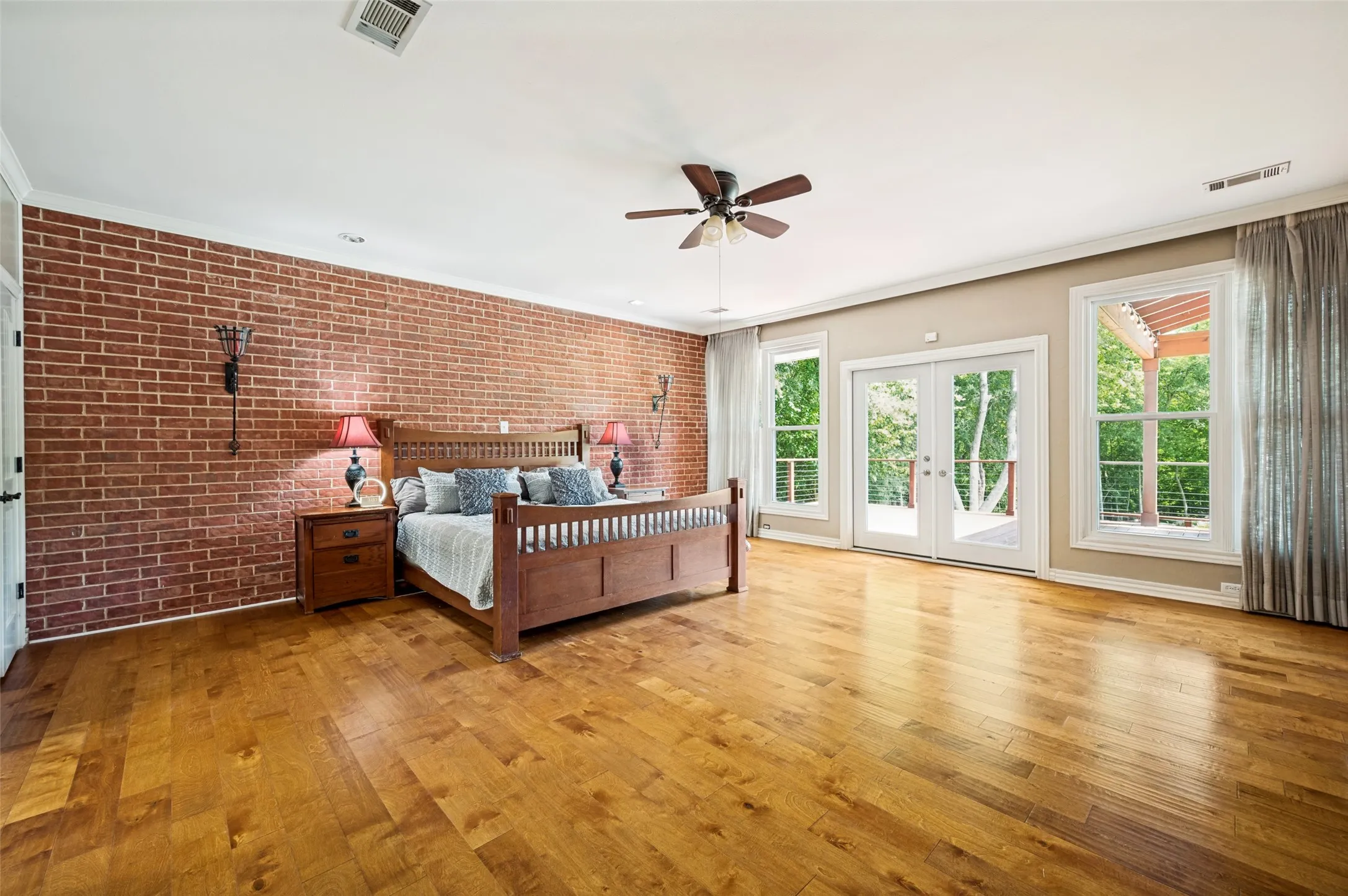 The Primary bedroom suite is very spacious with plenty of room for a sitting area. Doors lead to the covered porch. All windows and doors have been replaced.