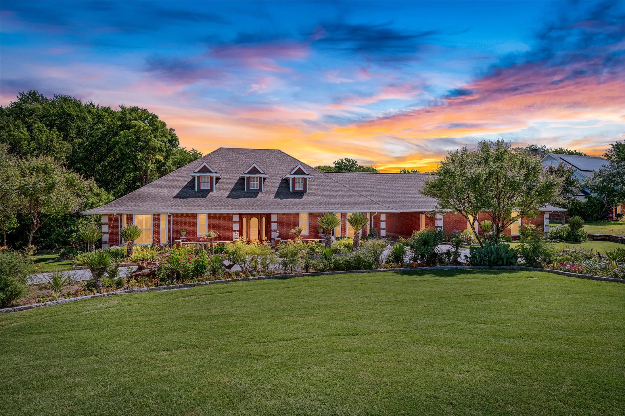 9 Country Ridge has a beautiful setting, set back from the road with amazing landscaping!