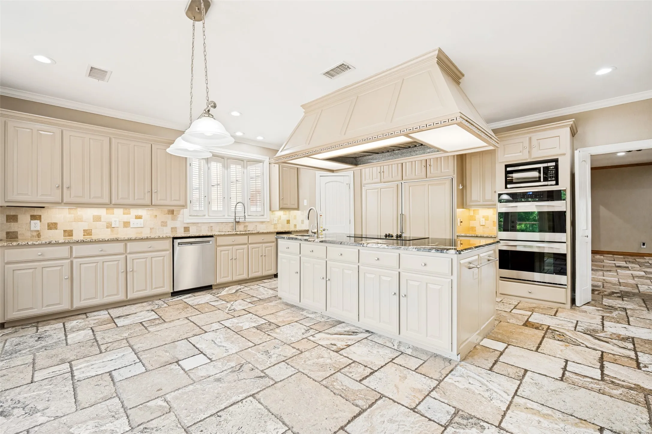 Large kitchen and breakfast area also make entertaining easy.  d-ovens, Sub-Zero fridge-freezer, and more.
