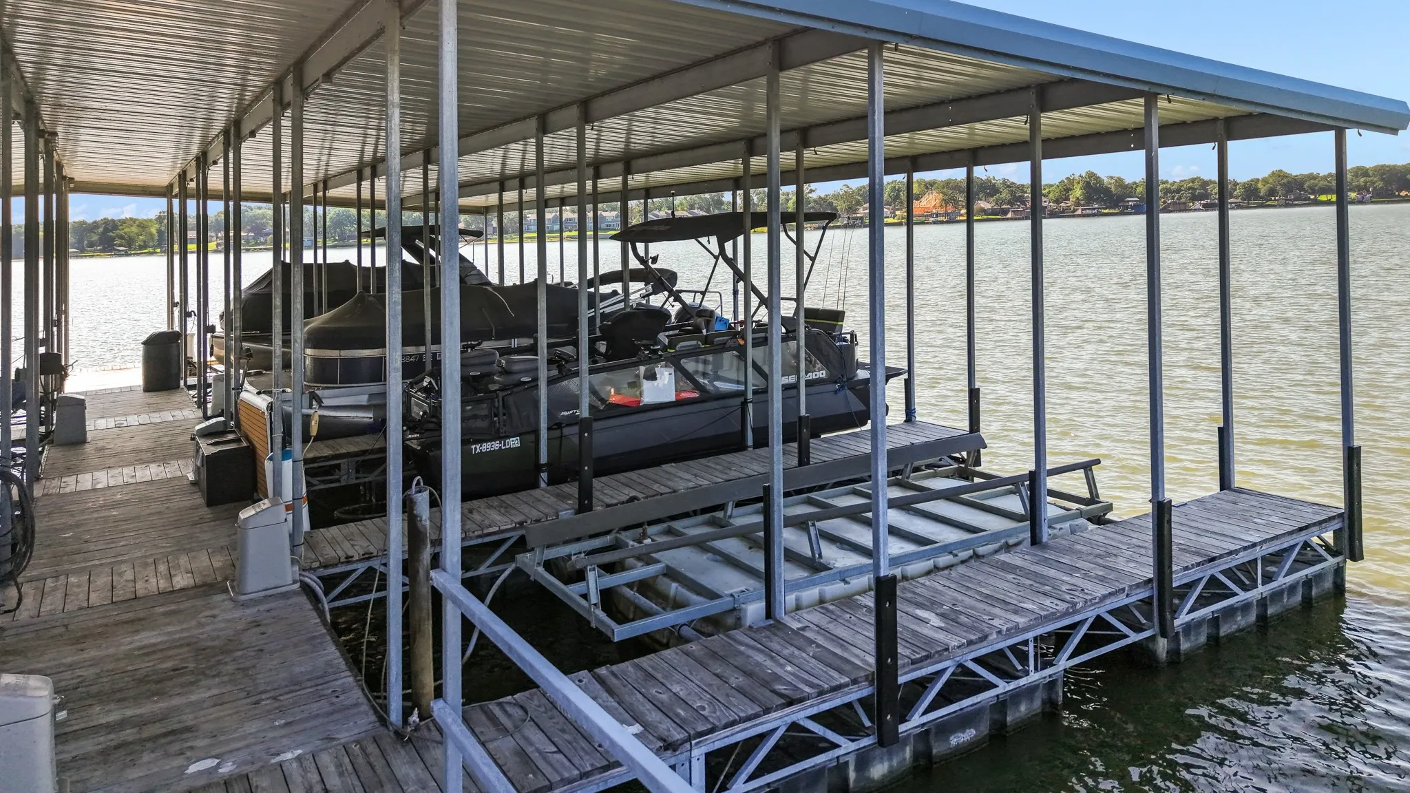 Included boatslip in community marina with longer slips and hydrohoist lift