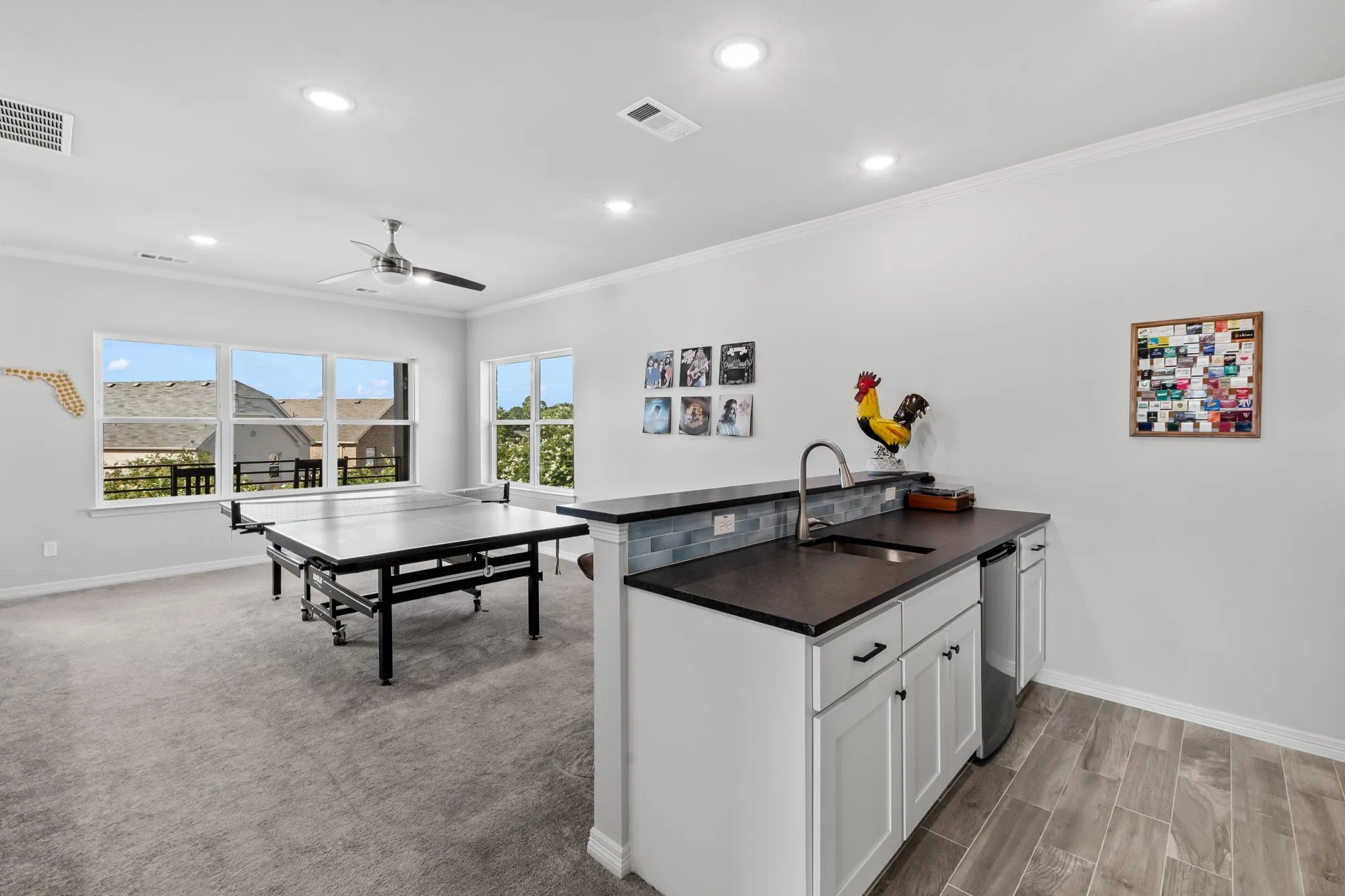 Upstairs bonus room with wet bar and balcony access