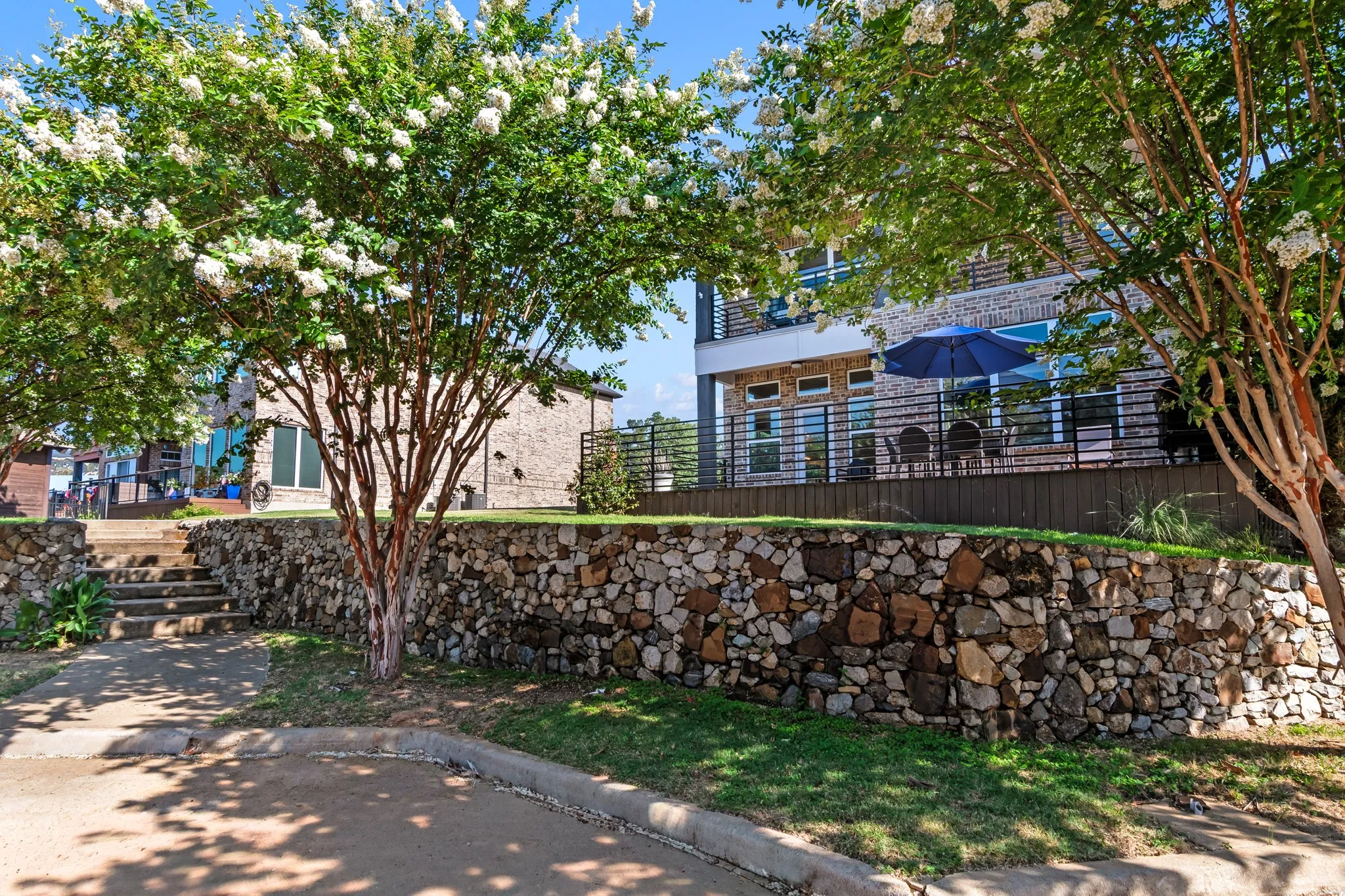 Back of home with easy access to additional nearby parking. Pool is to the left of stairs.
