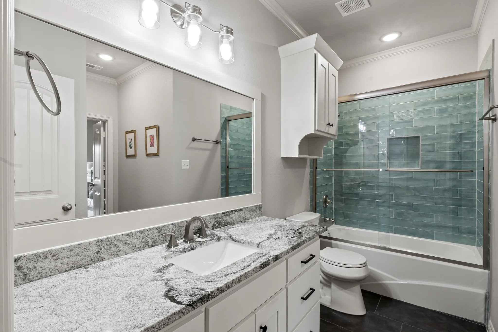 Upstairs guest bathroom that also connects to bedroom four