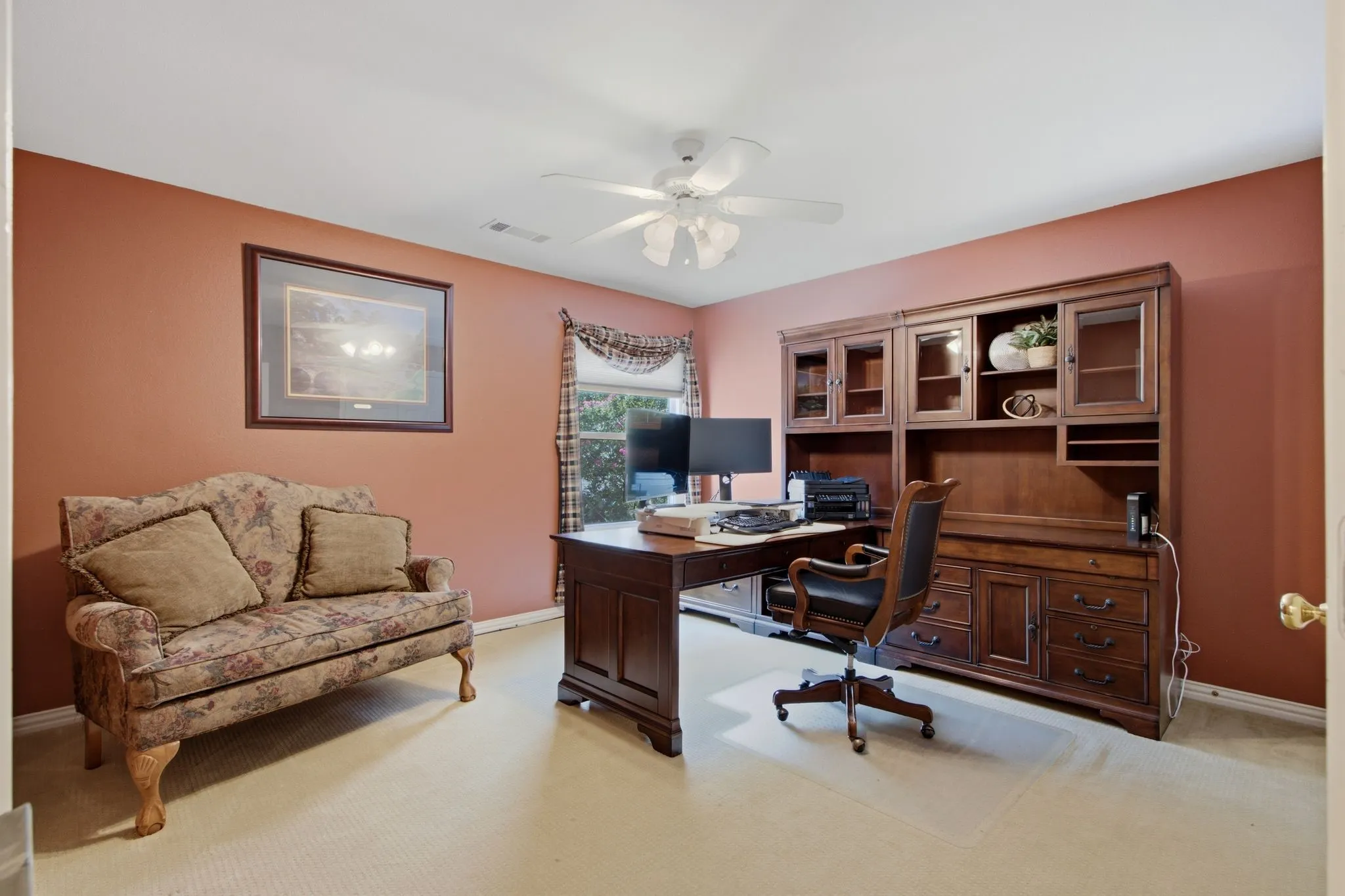 Built-in wood-finish cabinetry featuring glass-front doors, open shelving, and drawer storage