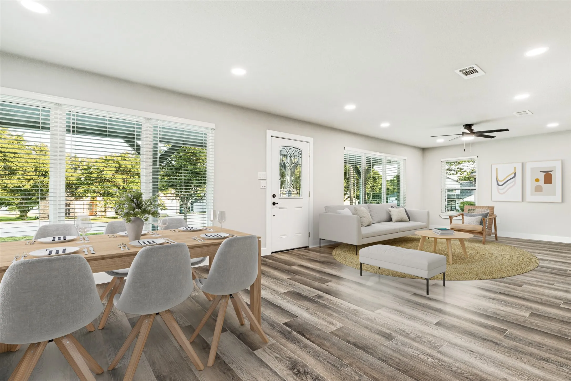 Virtually Staged-Open-concept living area featuring wood-finish flooring, recessed lighting, and a ceiling fan