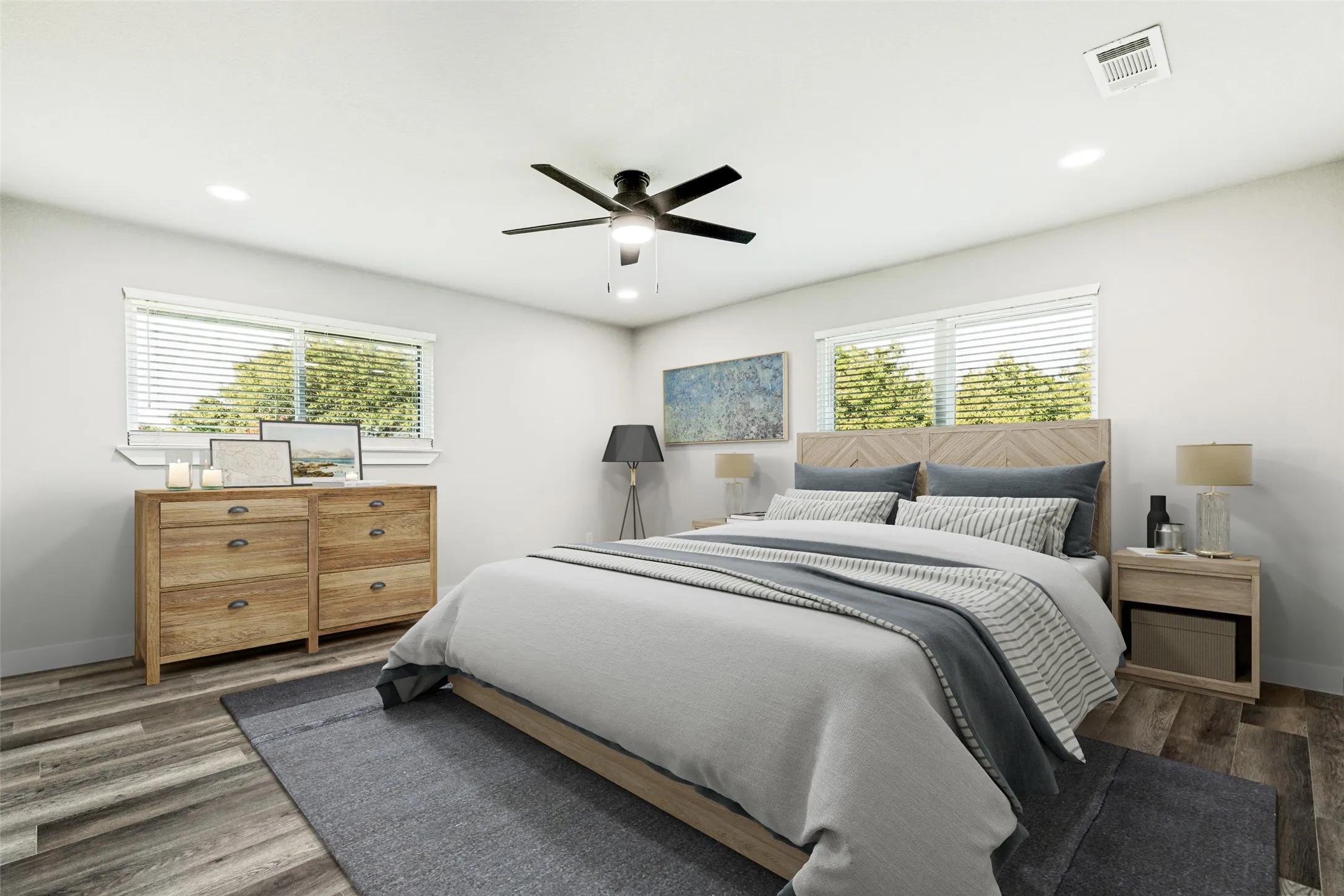 Virtually Staged-Spacious bedroom featuring light wood-finish flooring, white walls, and a ceiling fan with integrated lighting