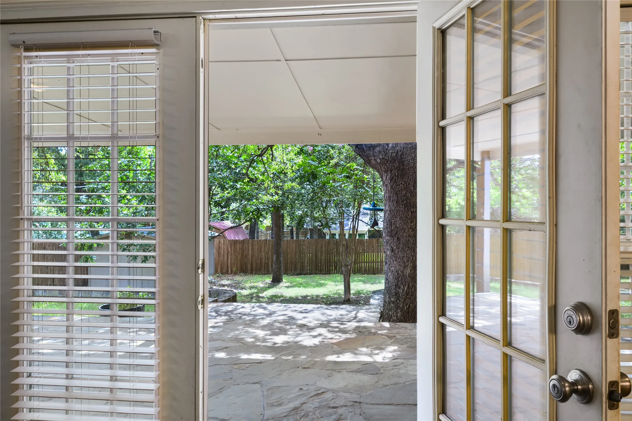 French doors from sunroom to back patio