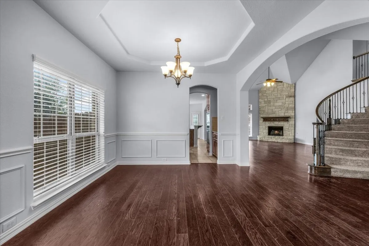 The formal dining room flows seamlessly from the formal living area, creating an inviting space for gatherings, special occasions, and entertaining.

