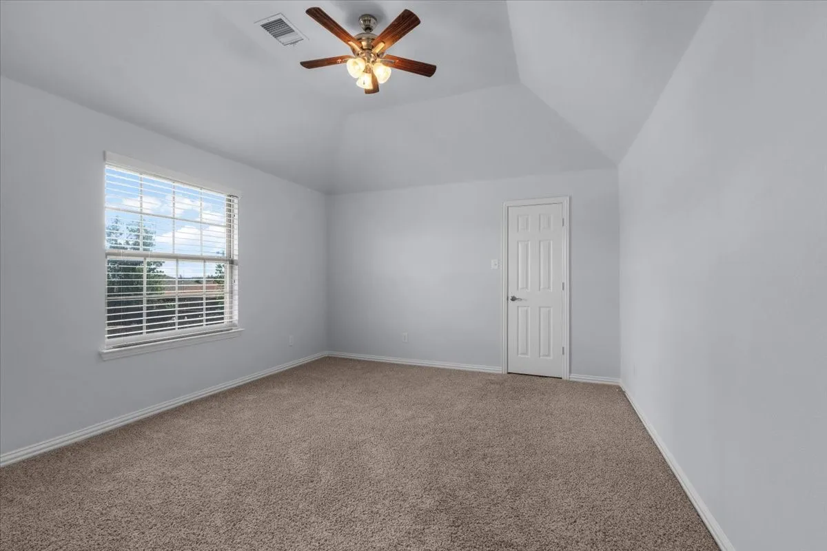 Bedroom with vaulted ceiling

