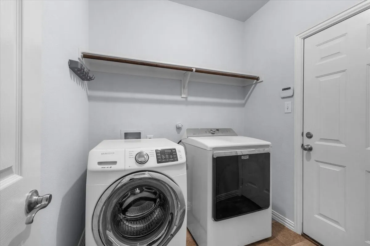Laundry room with washer and dryer