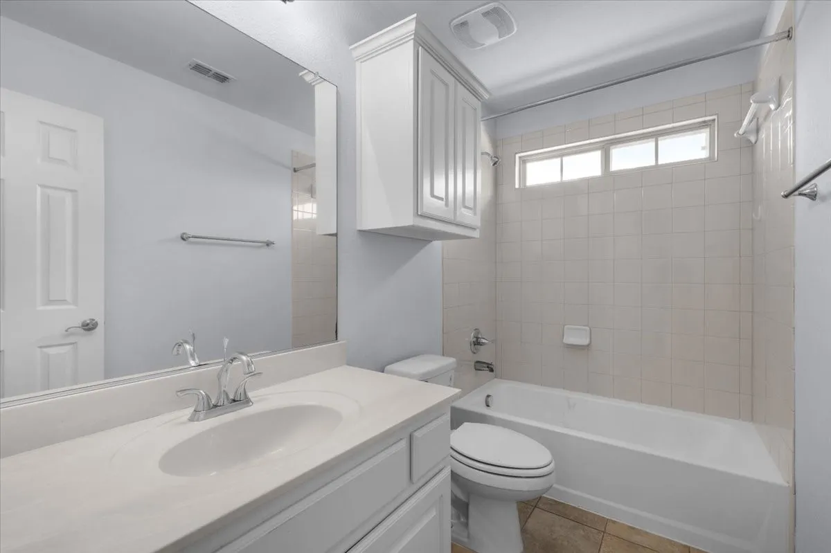 Bathroom featuring a single vanity with an integrated sink