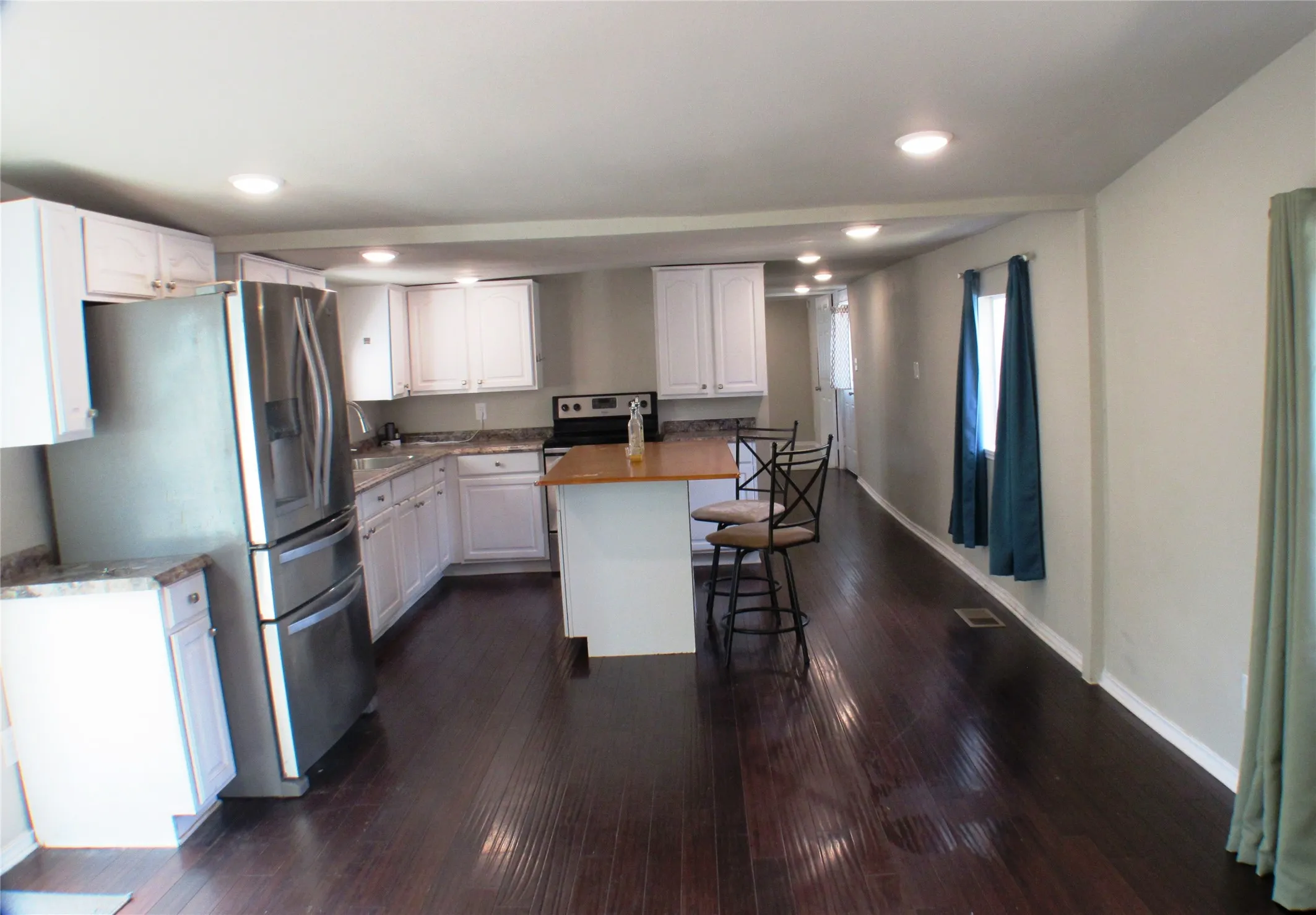 From the living room into the kitchen...