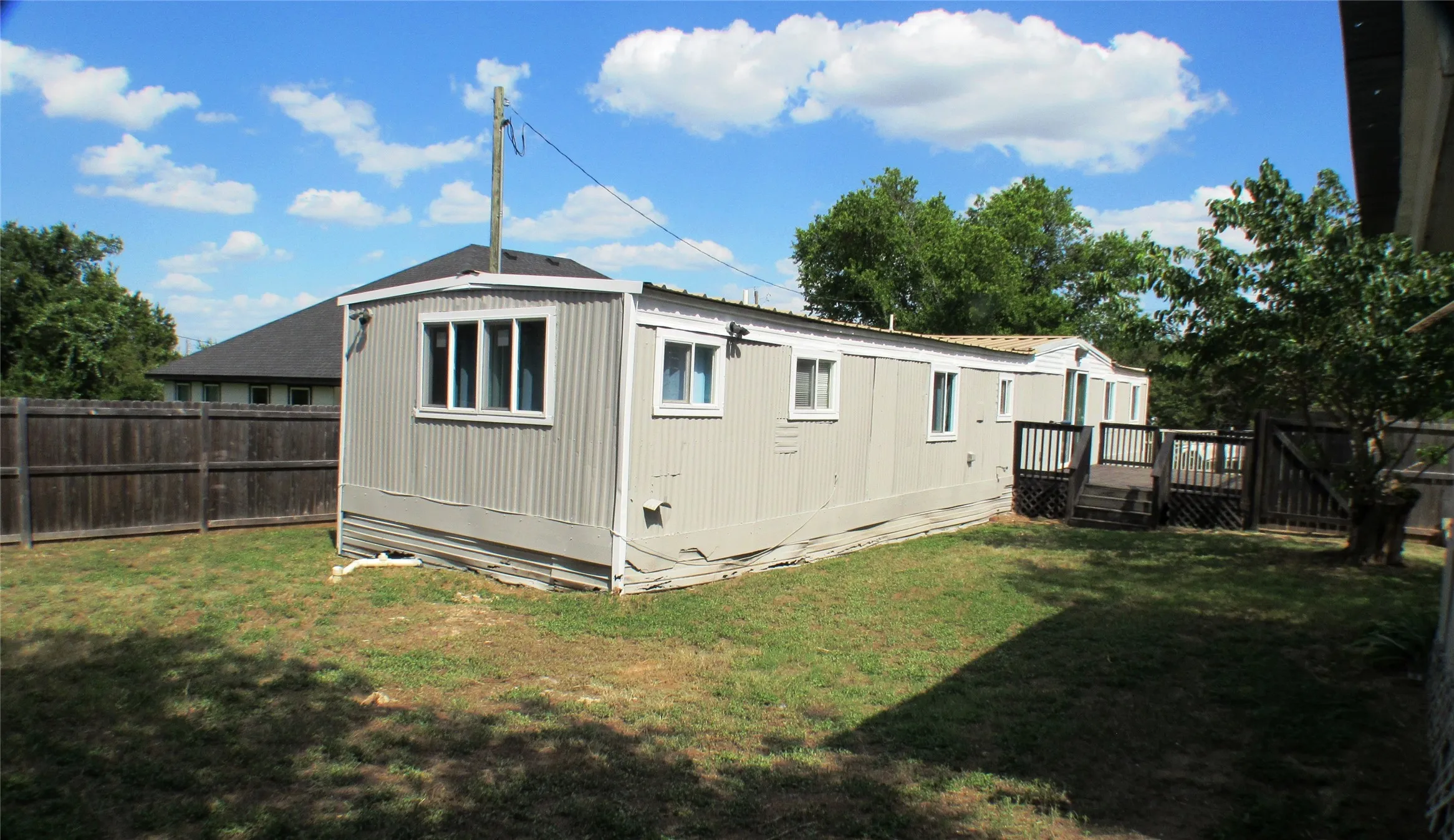 From the far corner of your yard towards the house and deck.