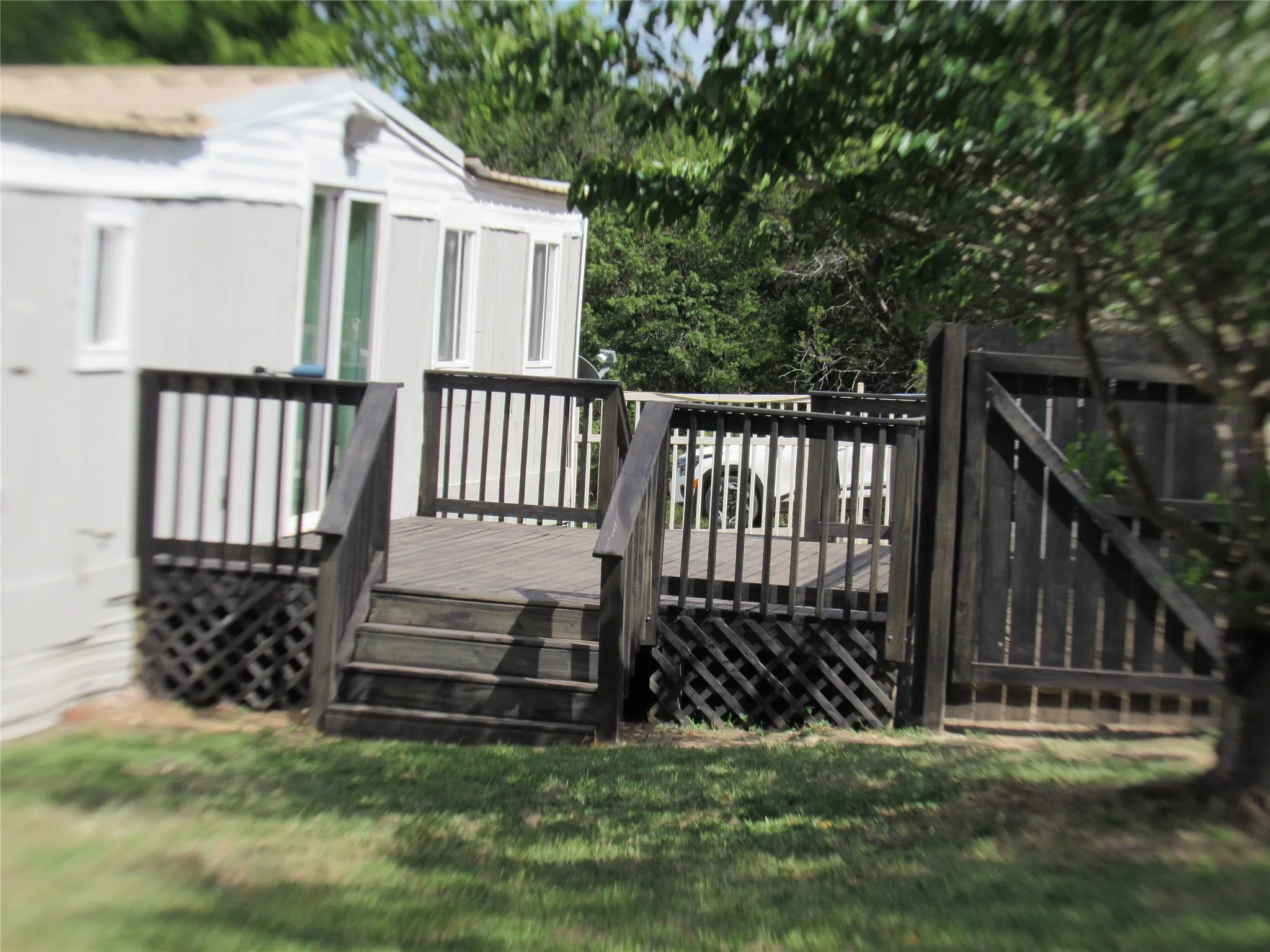 Good view of the deck, fence and gate..