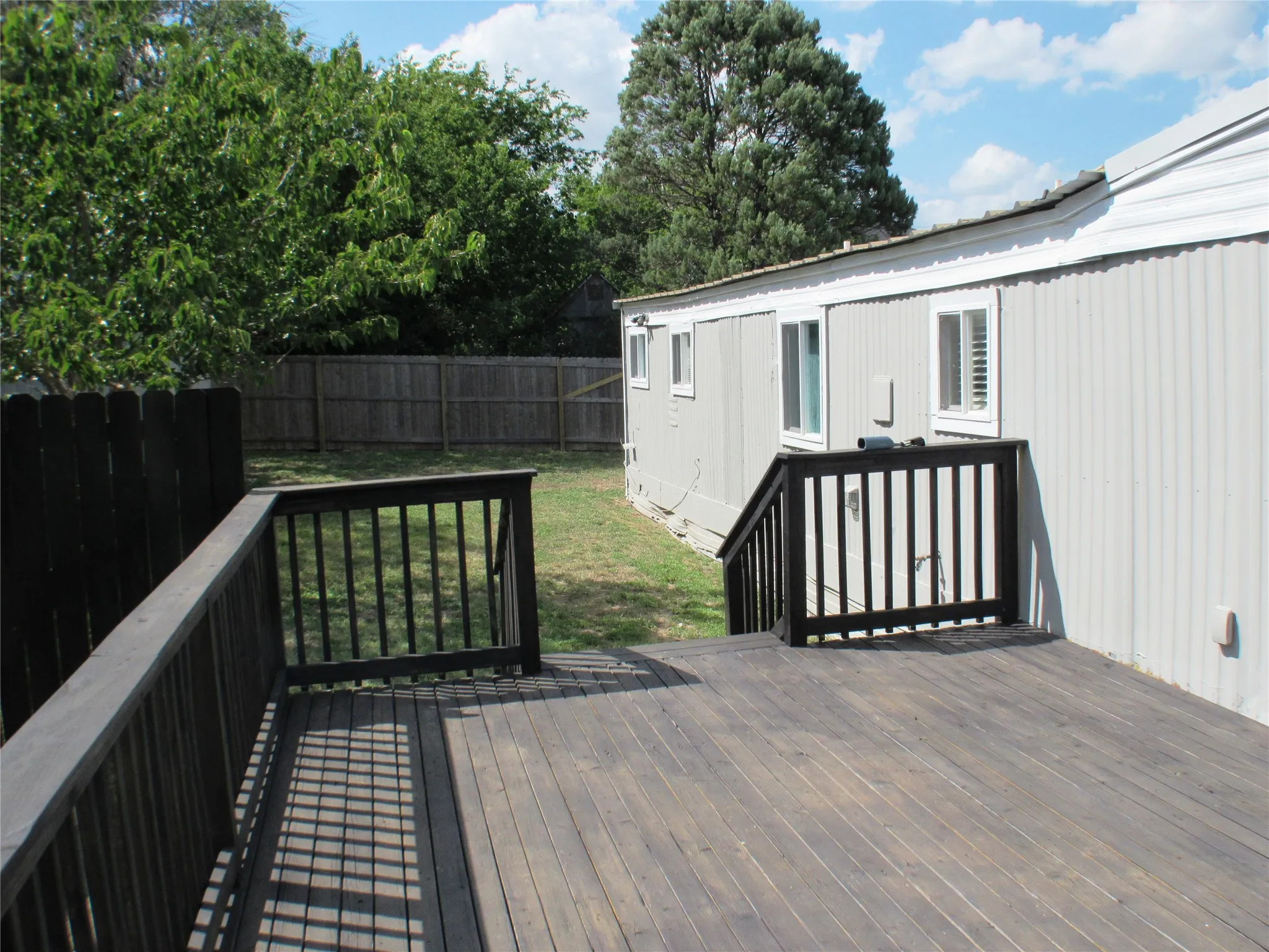 From the entry of your deck toward the back of it and down into your yard.