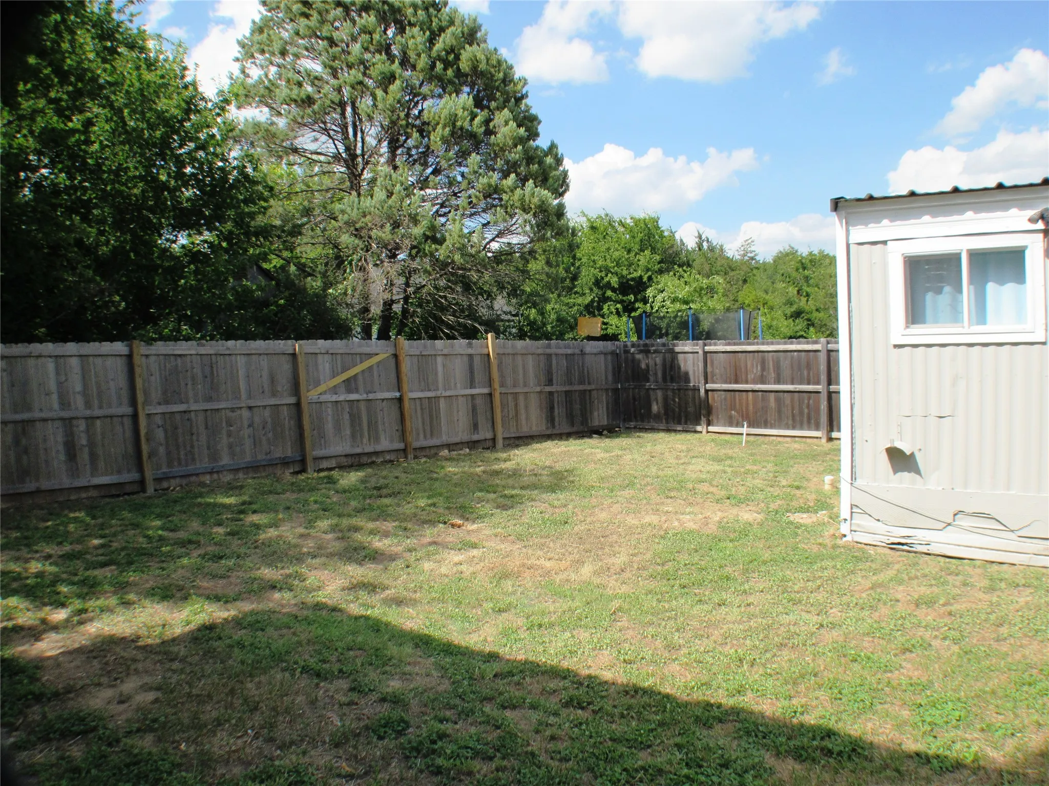 From the storage room towards the far corner of your lot.