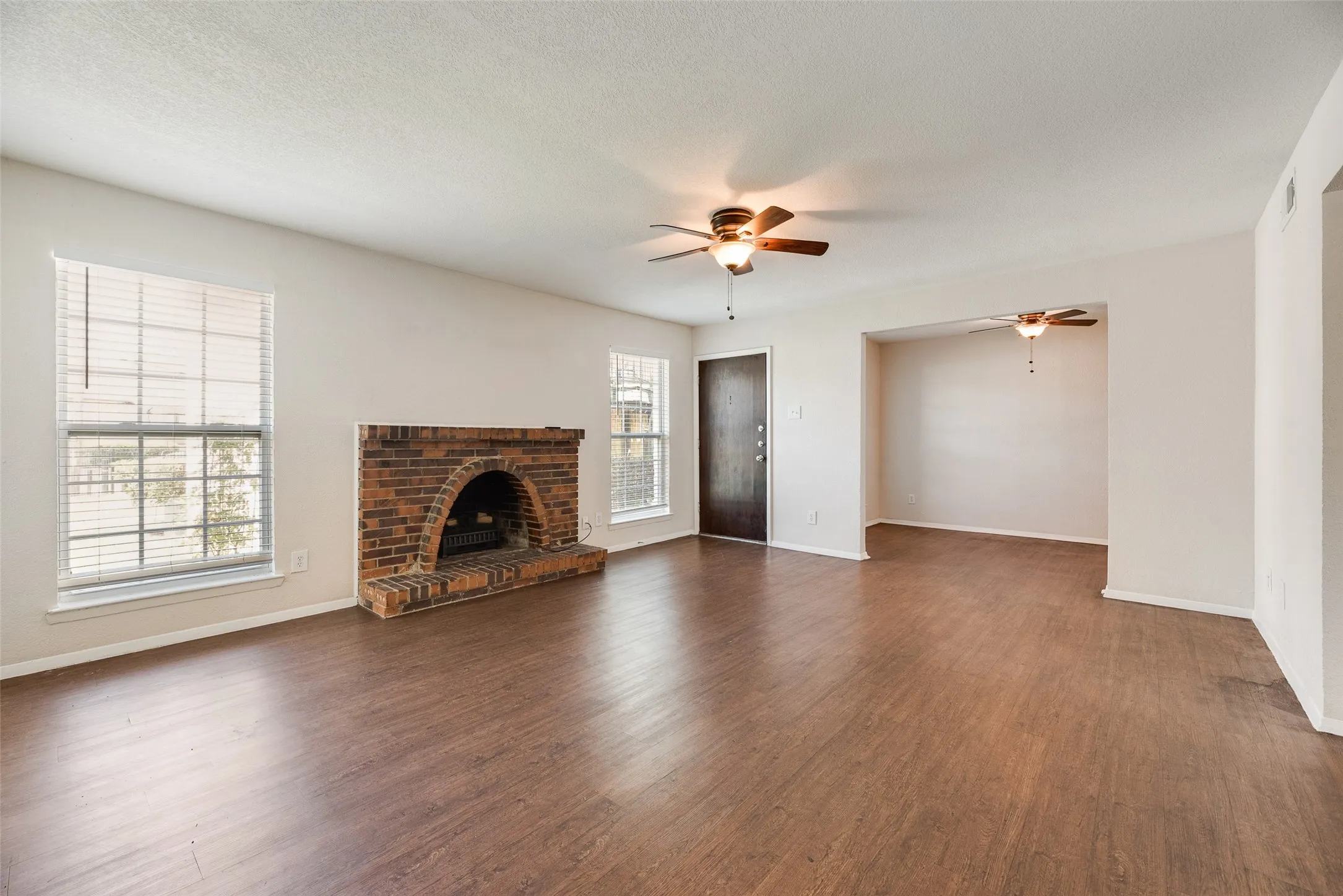 Very large living room with electric heater.