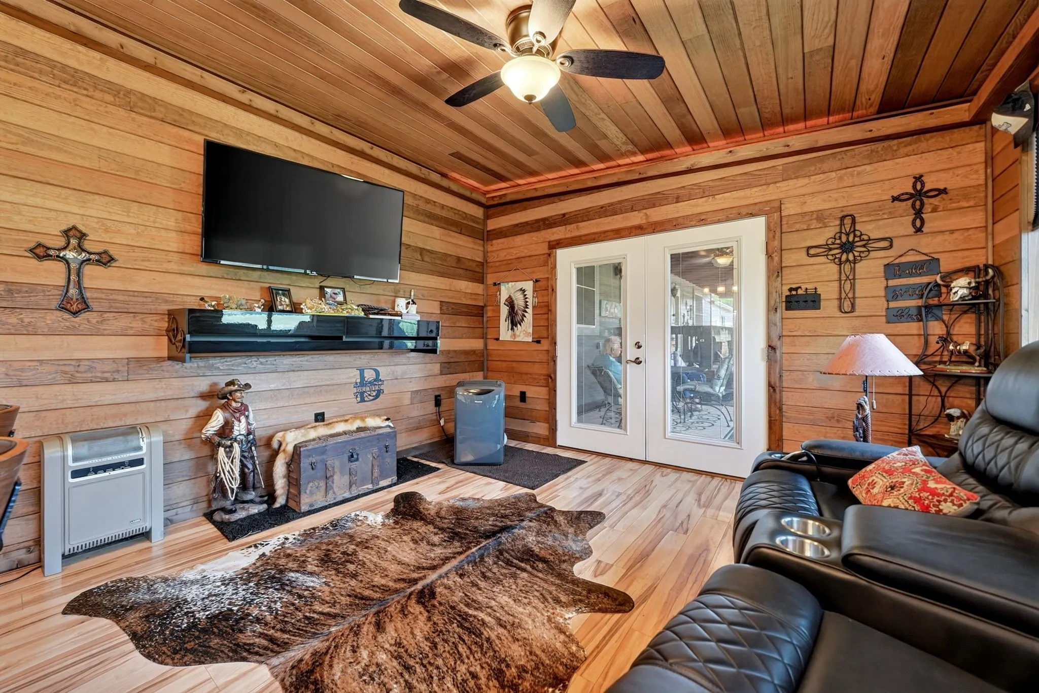 Wood-paneled room featuring a built-in bar