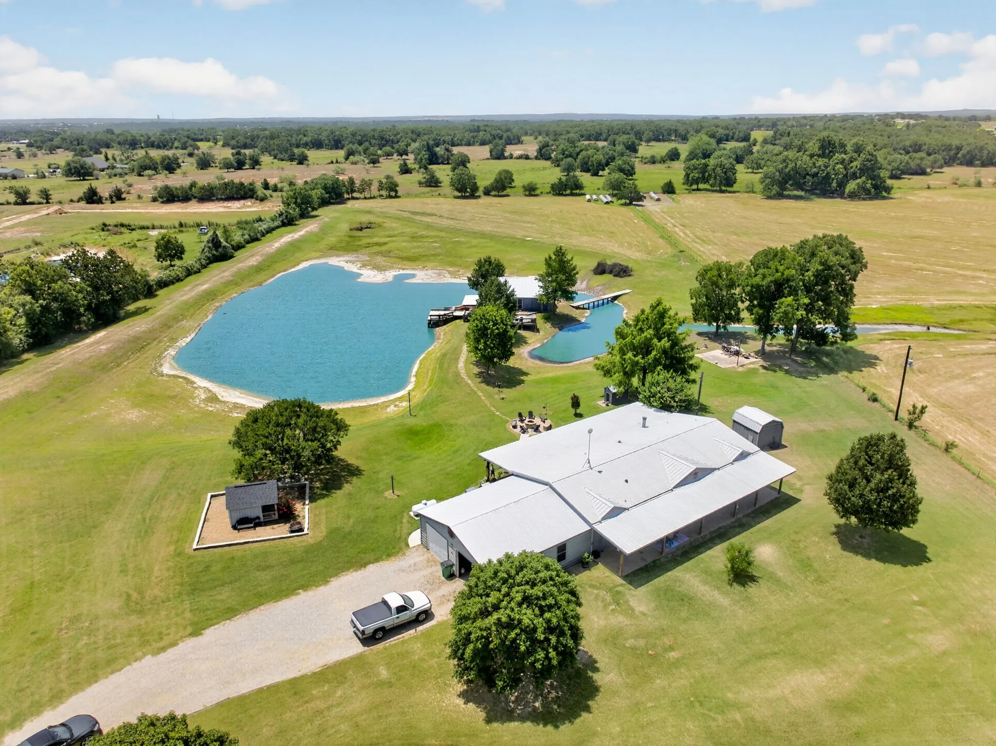 Aerial view of home and pond