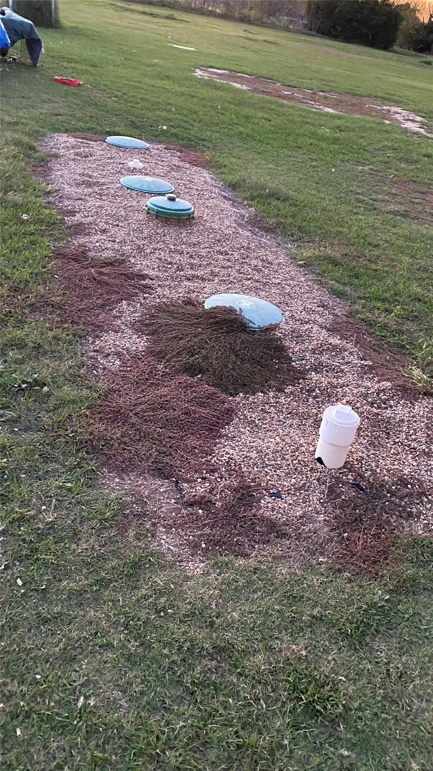 Previous photo showing the septic tank.  It is overgrown with grass now.