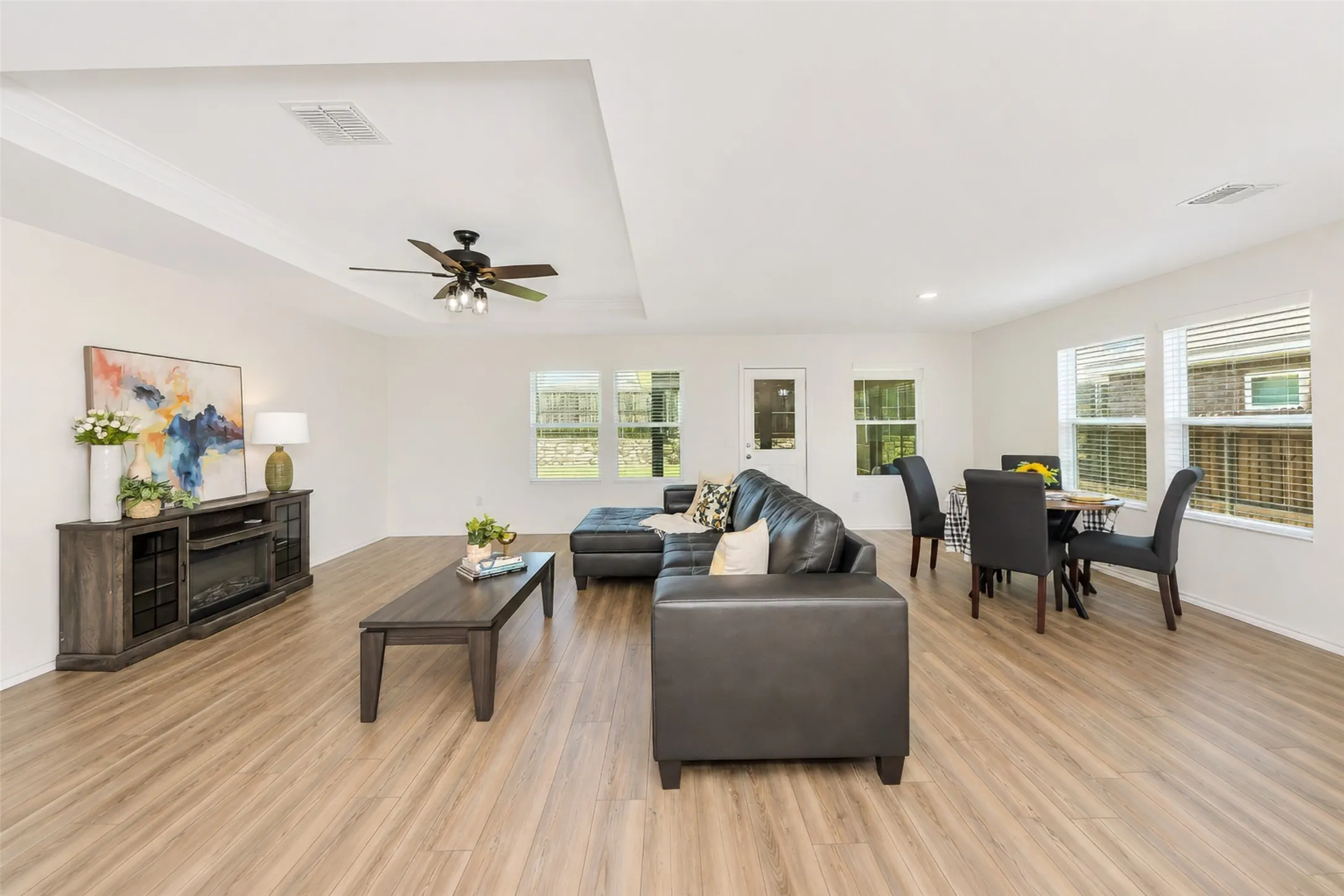 The living room, dining room, and kitchen are all open to one another.