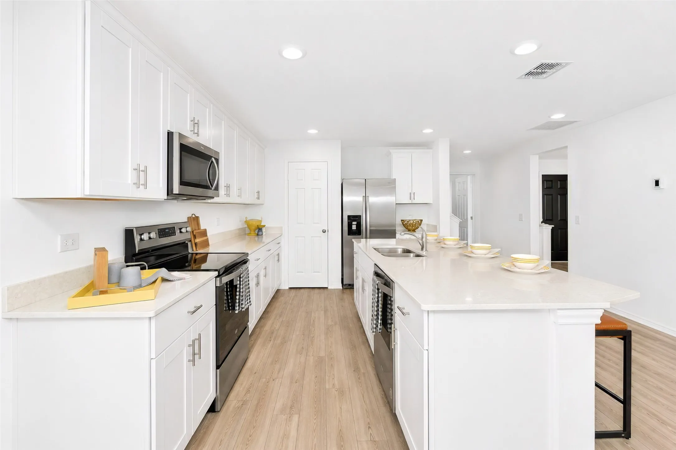 Lots of cabinetry! The range, microwave, and dishwasher are all Whirlpool.