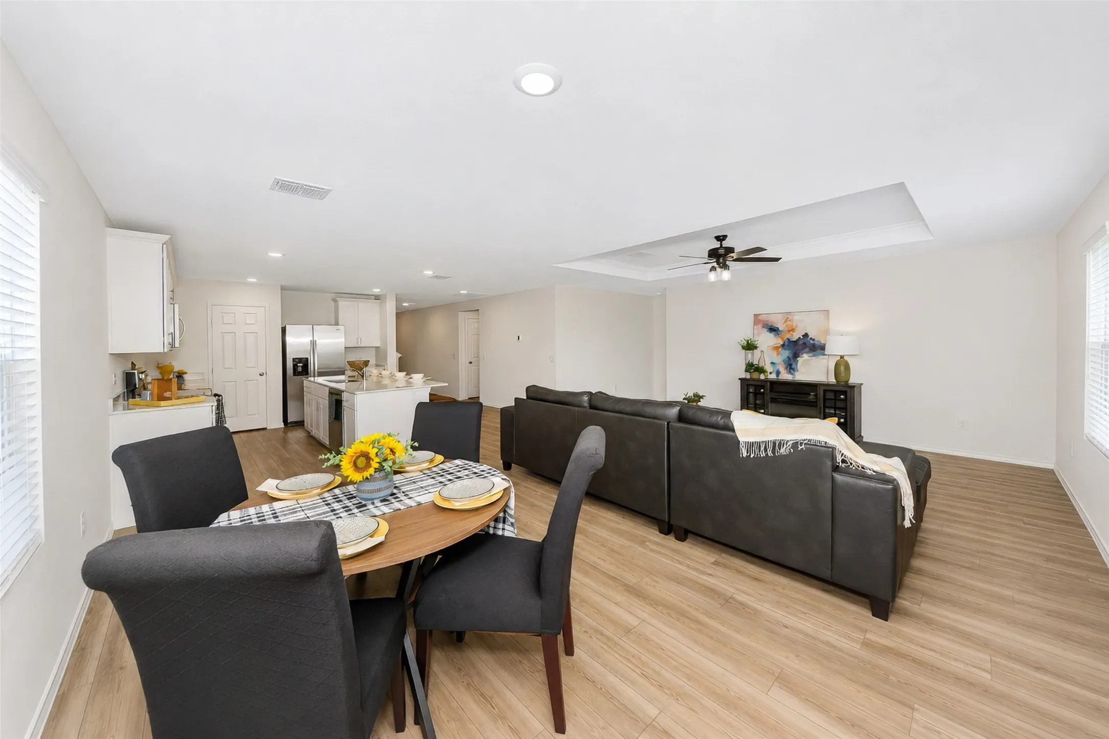 So roomy! A much larger dining room table will fit comfortably.