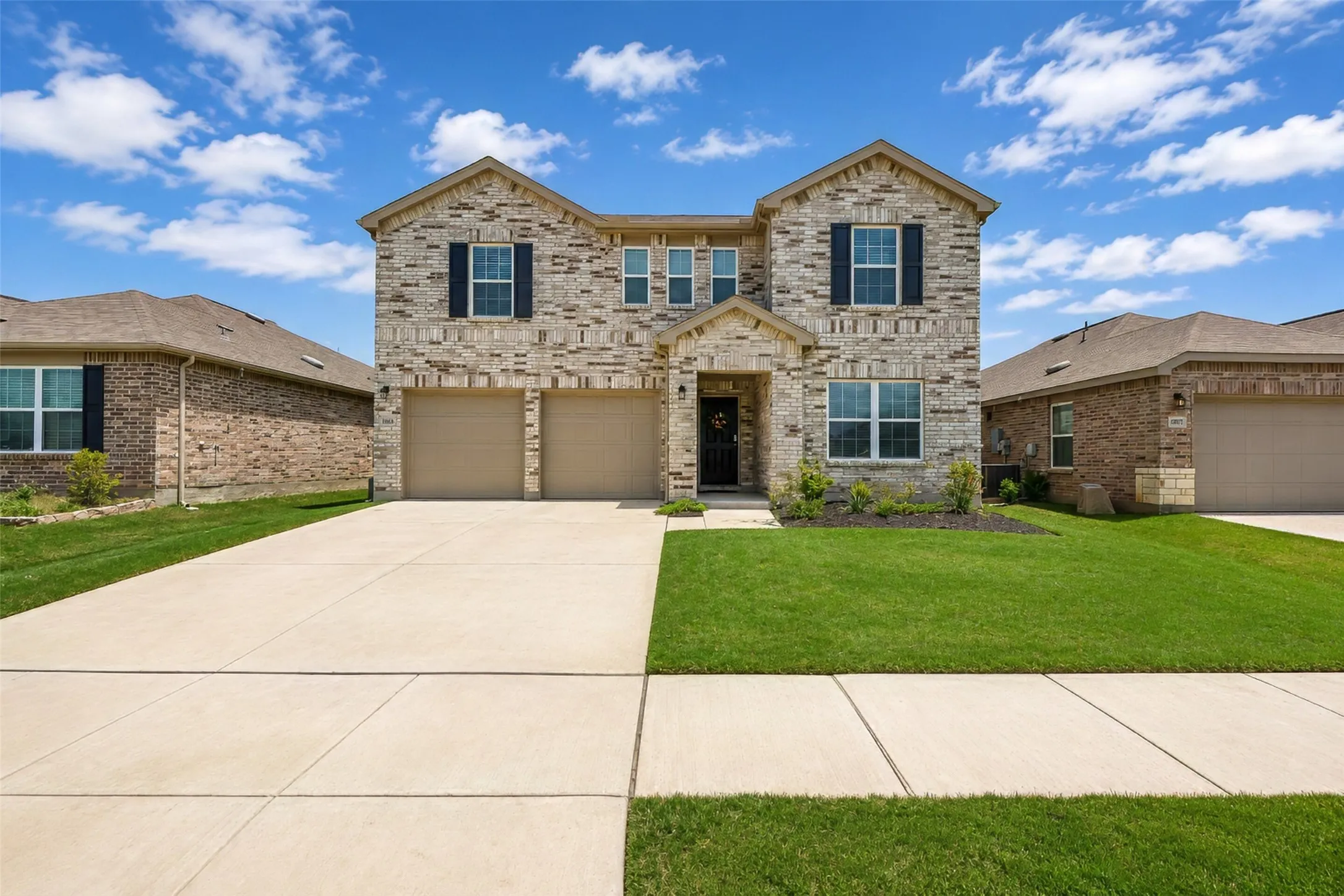 The office is located in the downstairs front of the home. The windows on top are in two of the secondary bedrooms, and the middle 3 windows are in the game room.