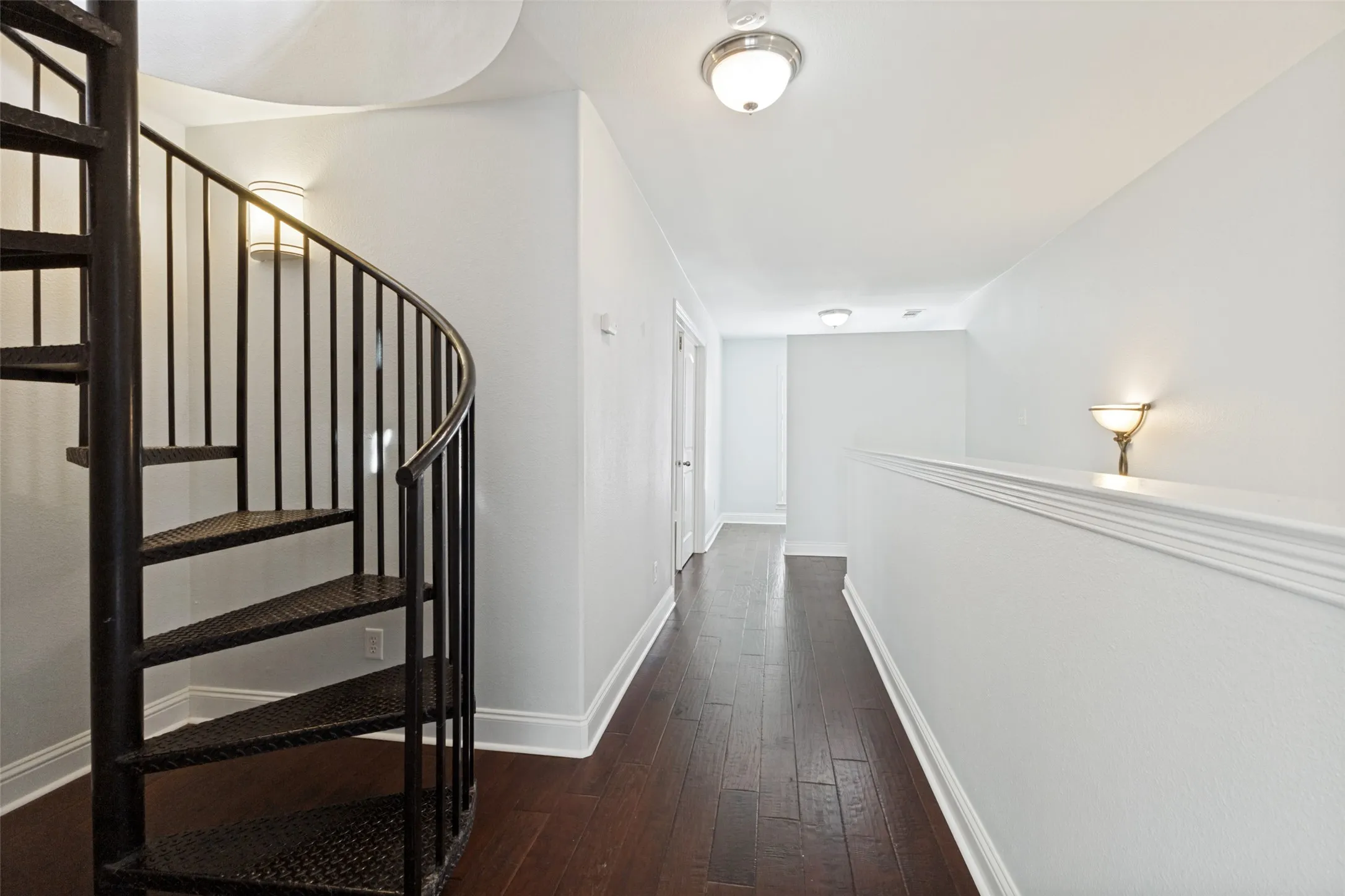 The spiral staircase leads to the rooftop patio