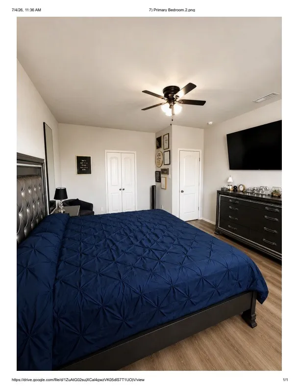 Spacious room featuring wood-finish flooring and a ceiling fan with integrated lighting