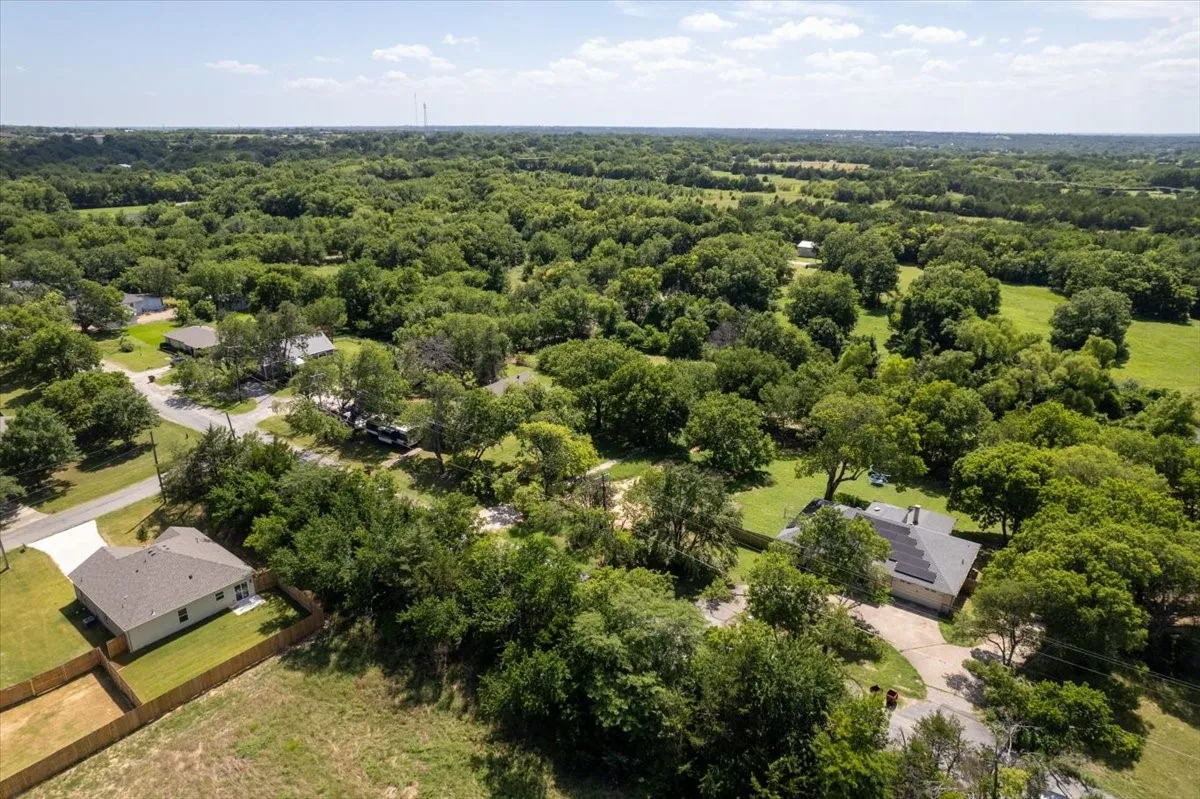 looking east — open land and established neighborhood