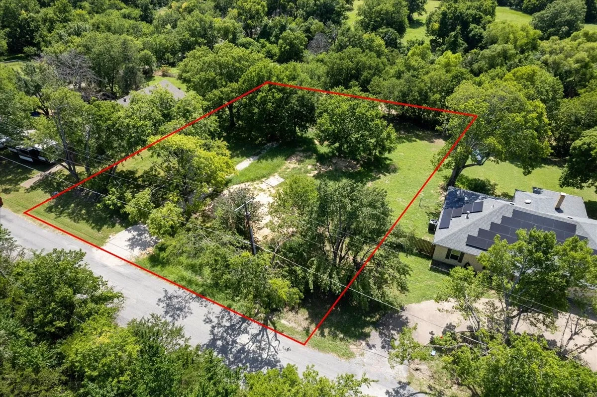 treed lot among established homes