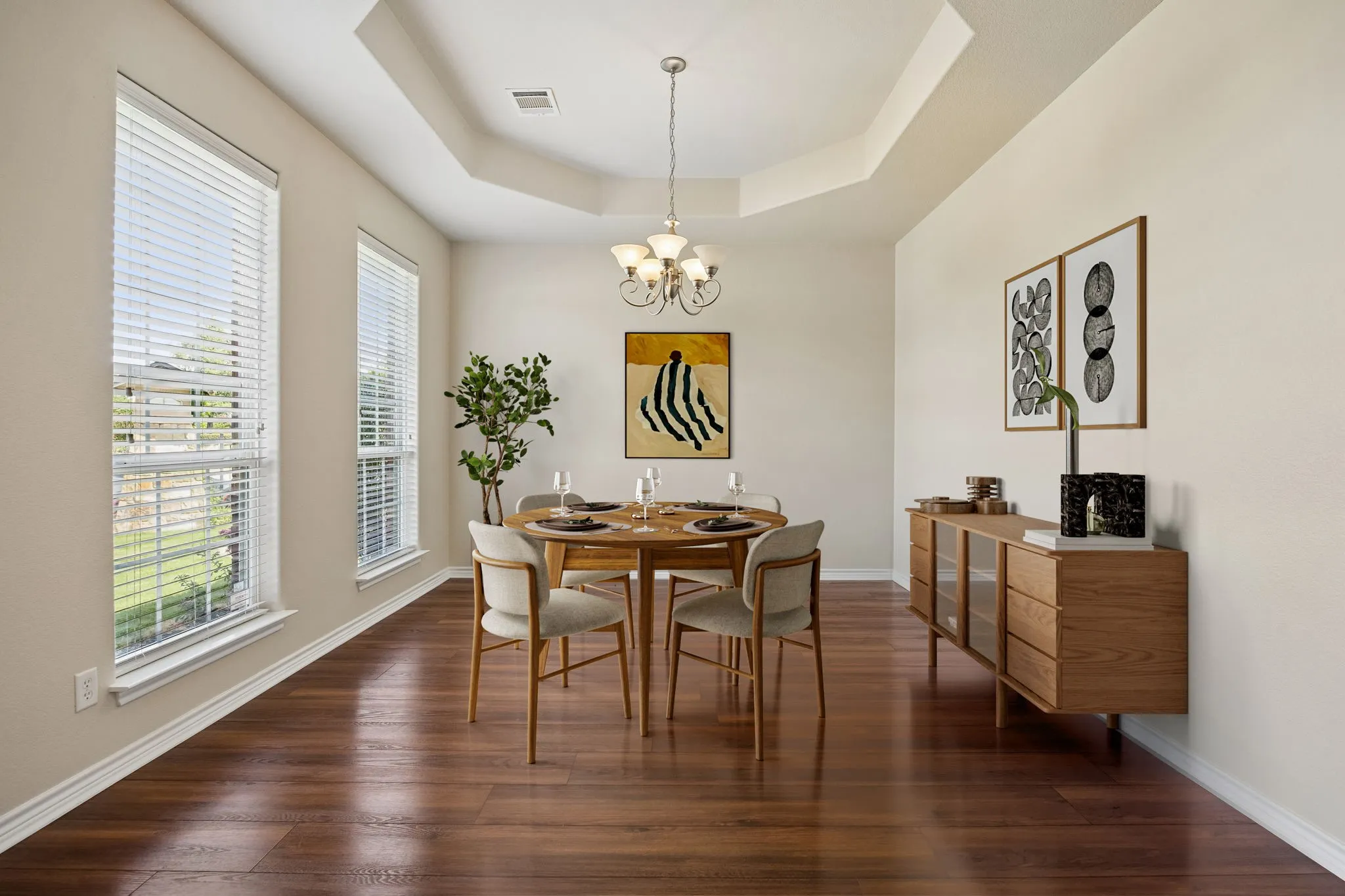 Virtually staged formal dining room off foyer.