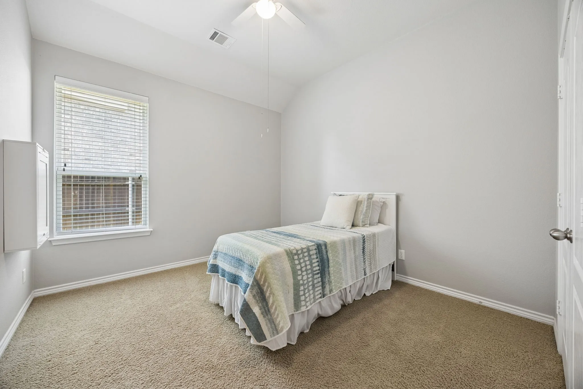 One of three downstairs bedrooms.