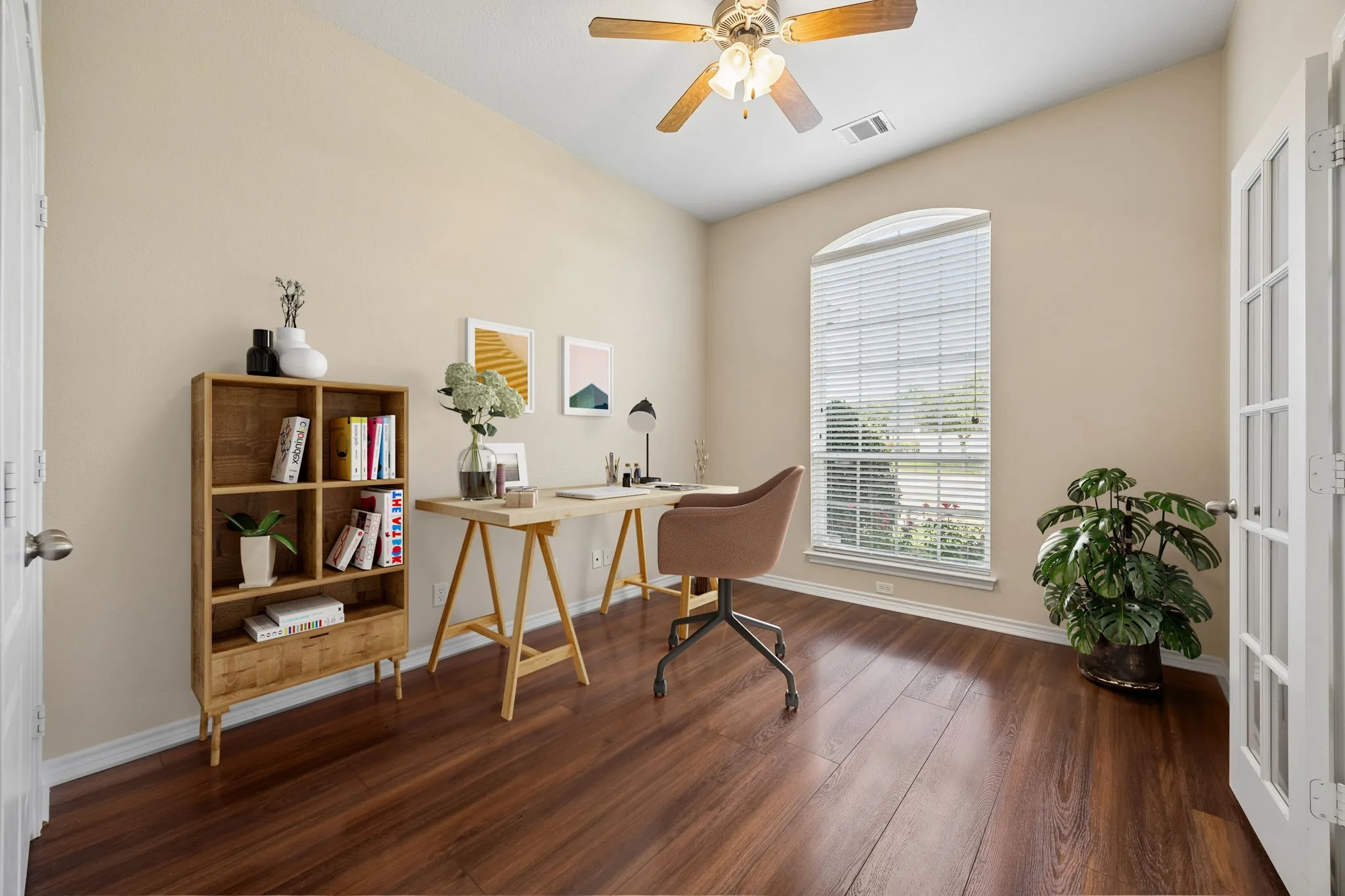 Virtually staged formal living room could be a formal library.