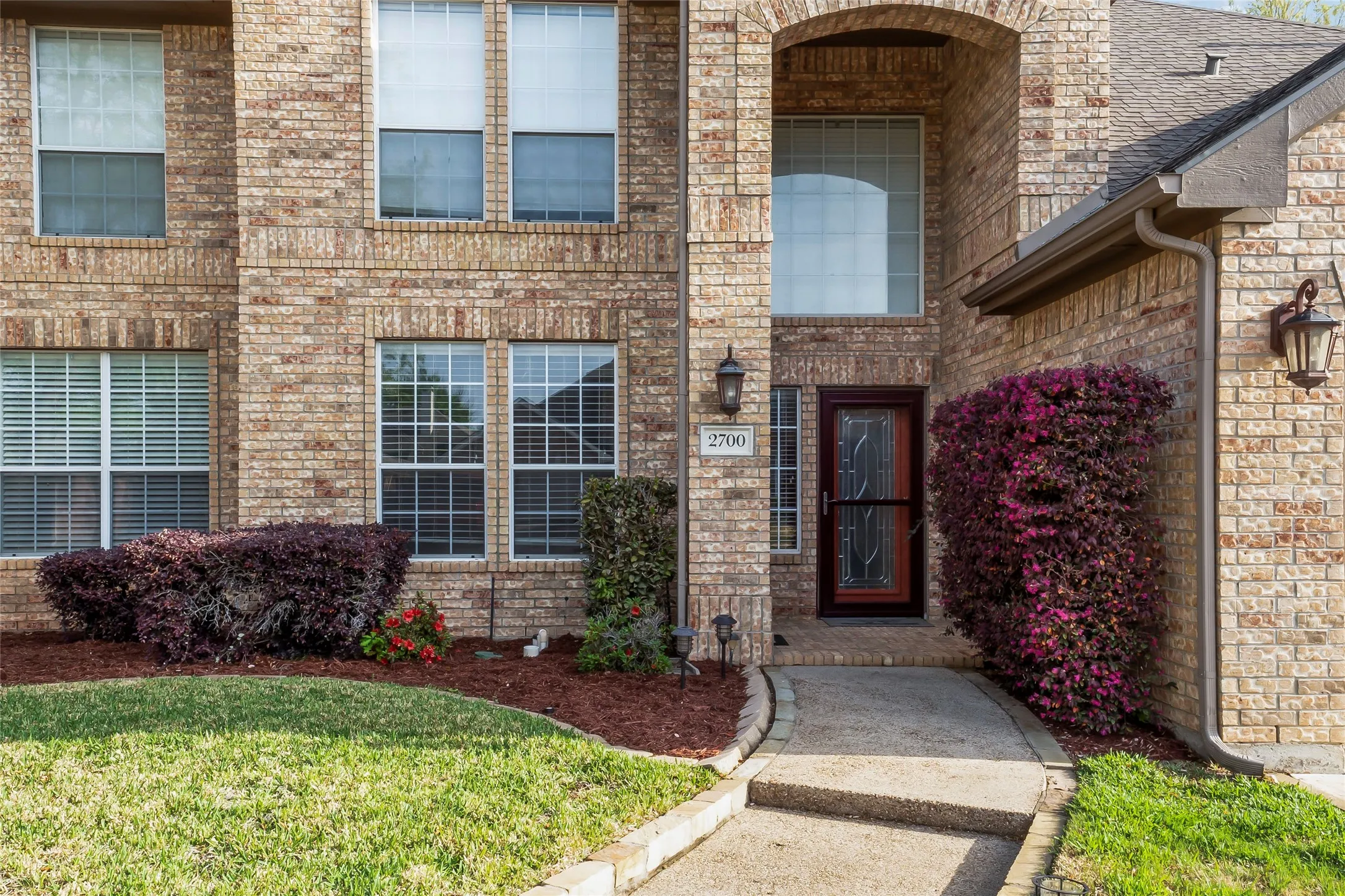 Brick exterior with an arched entryway