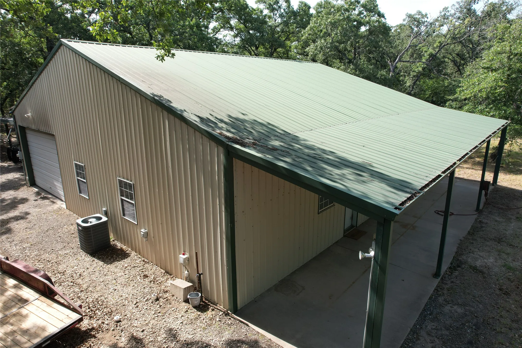 View of southeast corner of Barndominium and the coverd entry porch and