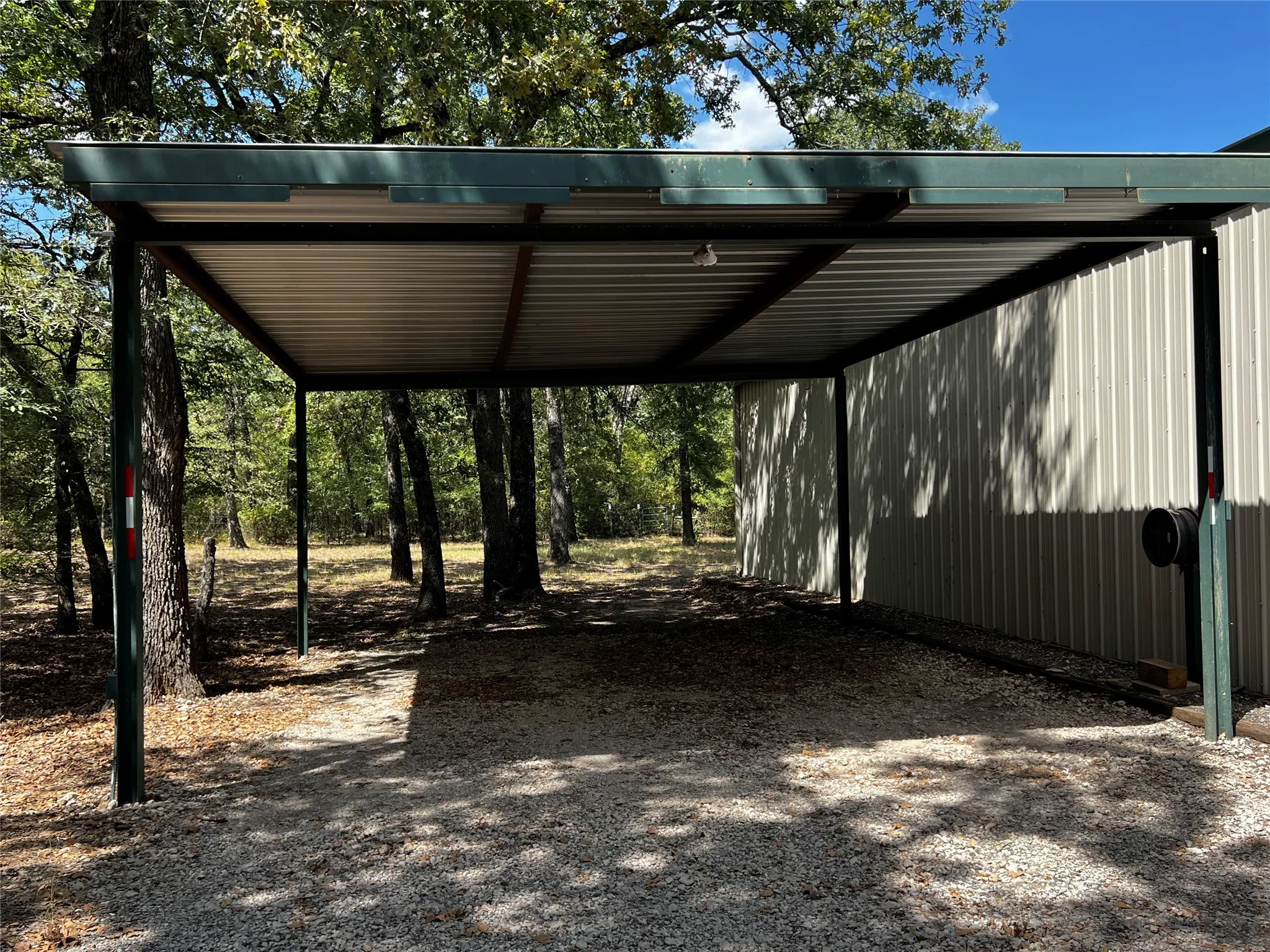2 car carport adjacent to main garage shop