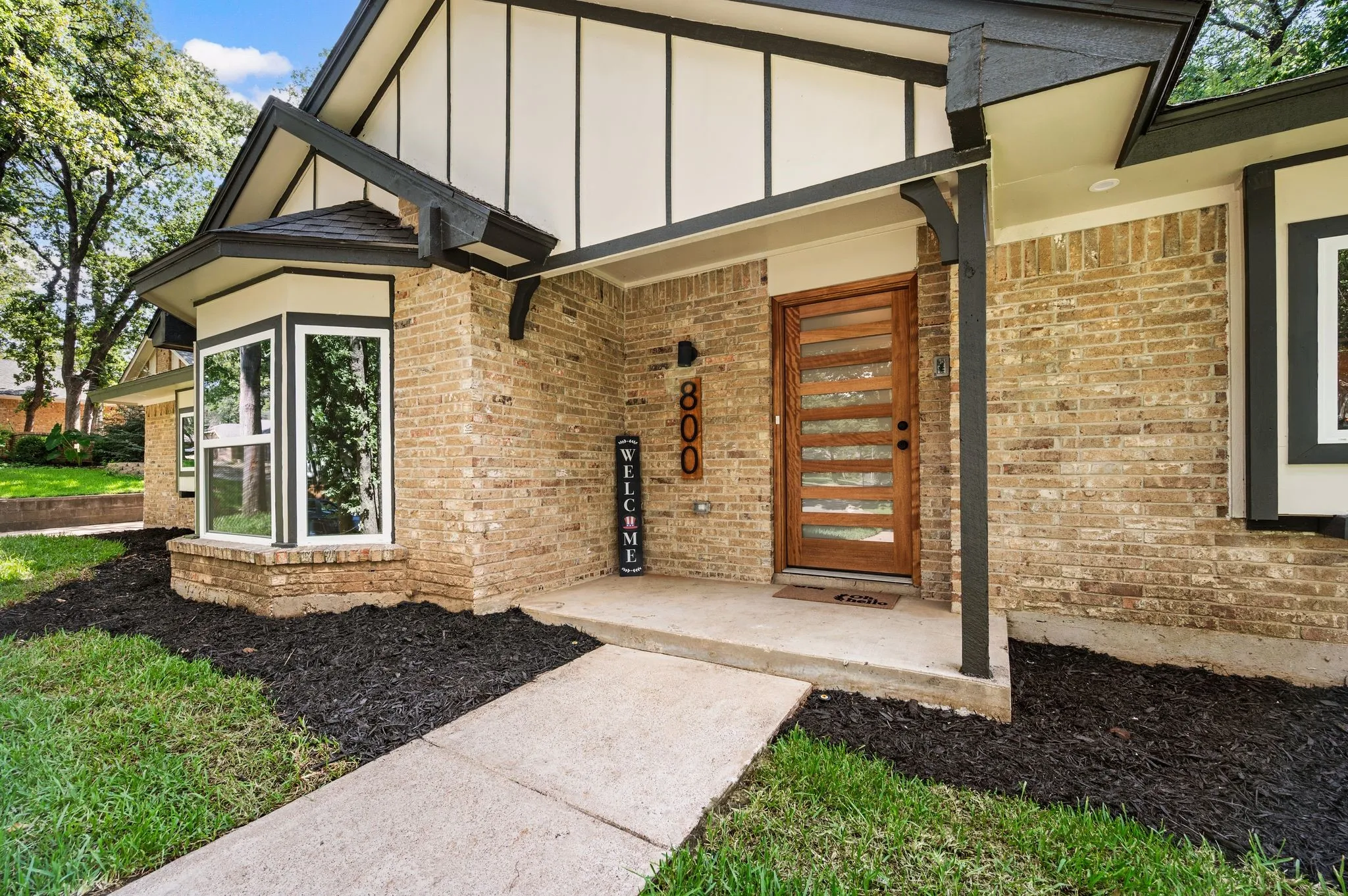 A warm Mahogany front door adds a custom touch before you ever step inside.