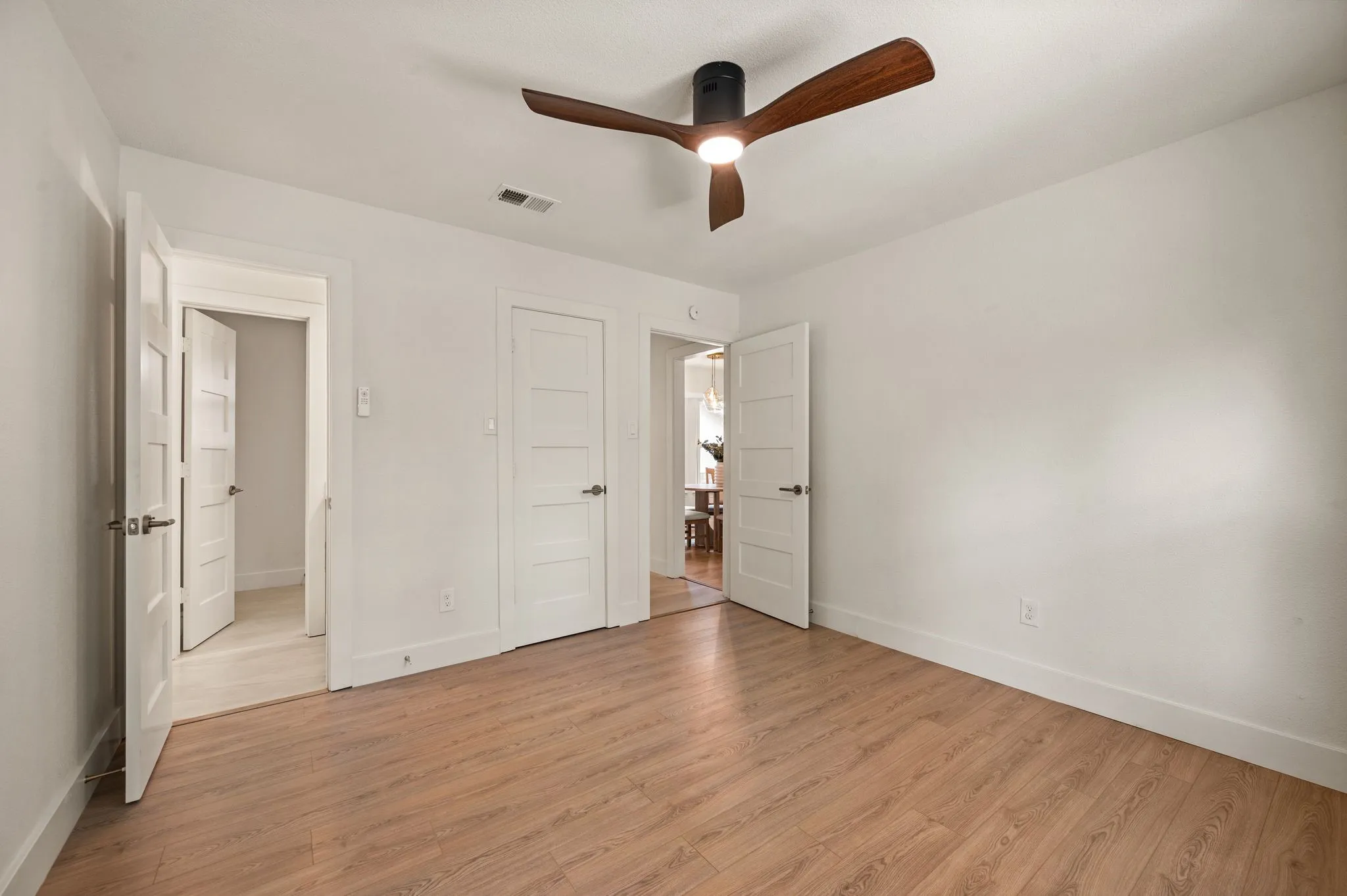 The secluded fourth bedroom features a bright bay window and creates an ideal retreat for guests or an older child.