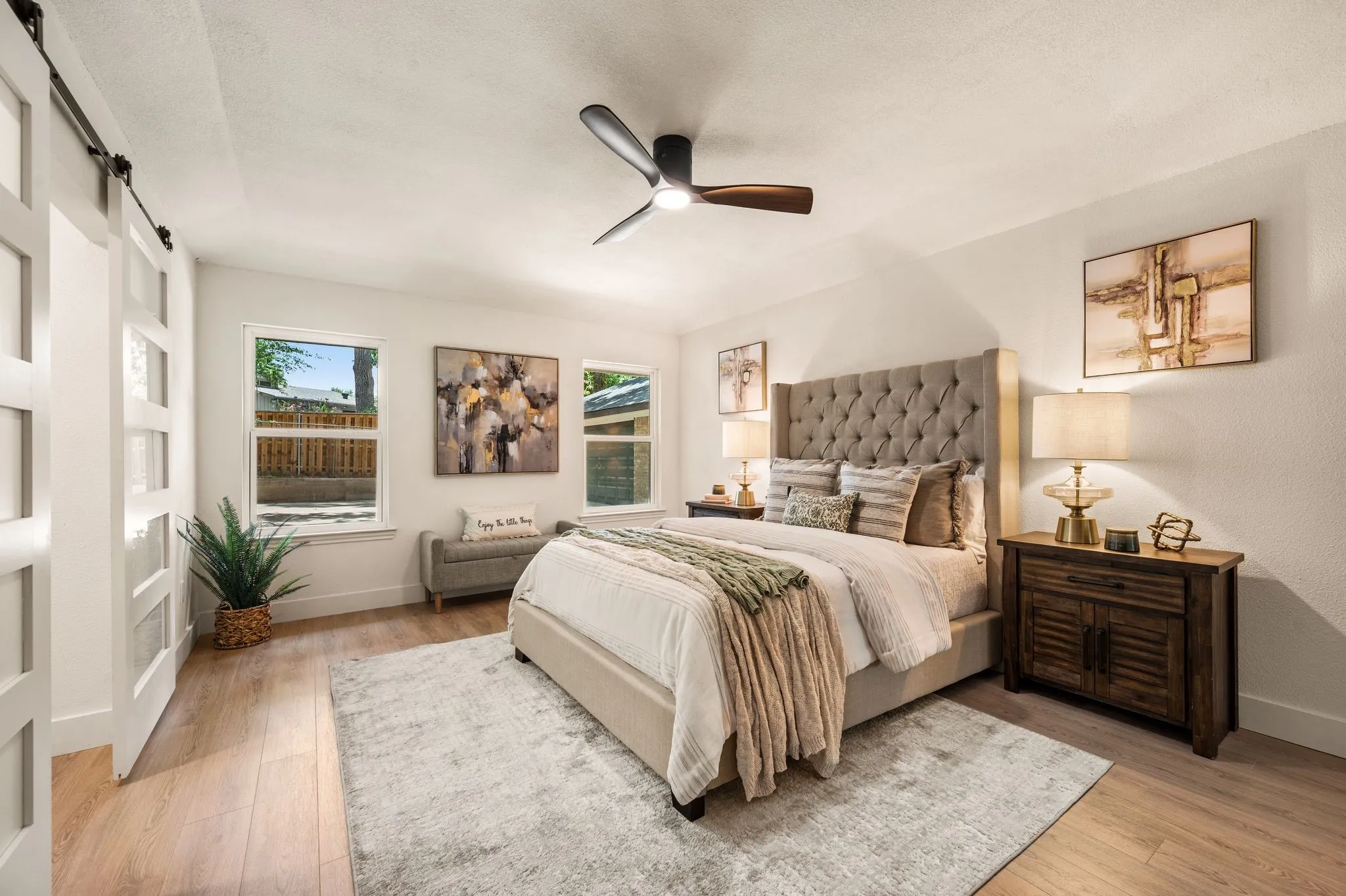 Soft natural light and generous proportions create a primary bedroom designed for unhurried mornings and restful evenings.